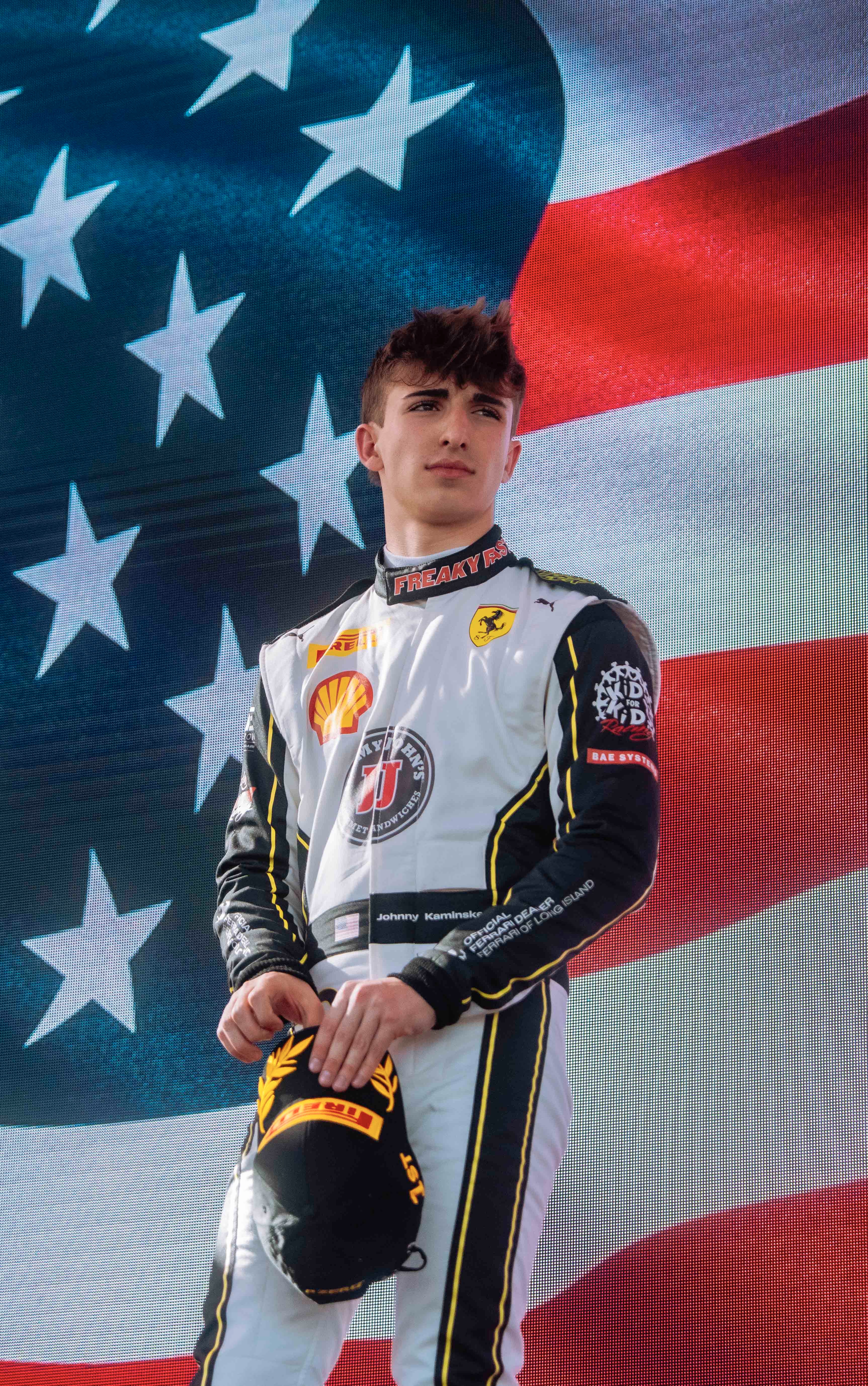 Johnny Kaminskey on podium with trophy during Ferrari Challenge Event after Race