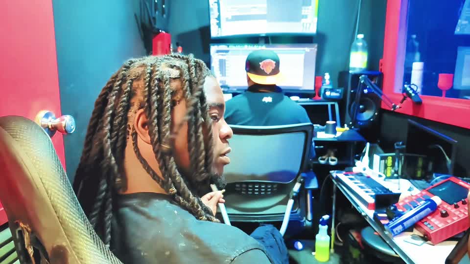 Artist and engineer working in the recording studio