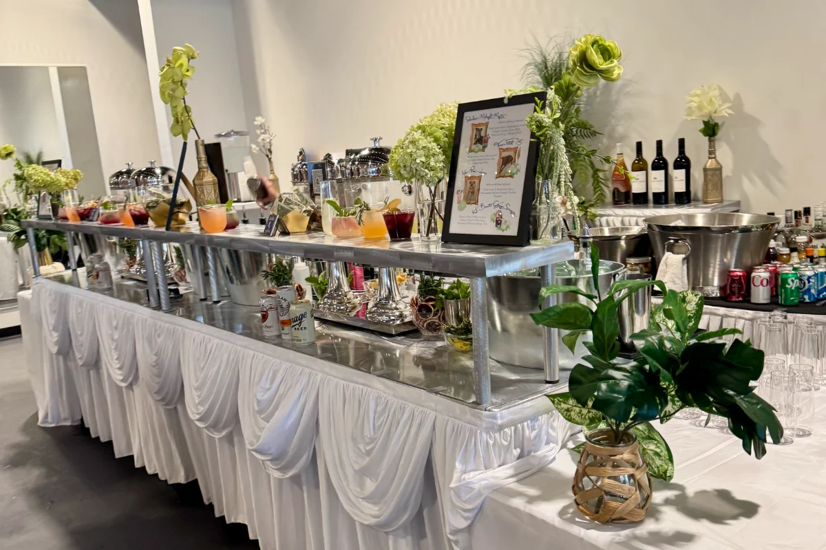 Bars on Wheels elegant cocktail station setup with floral decor at upscale wedding reception
