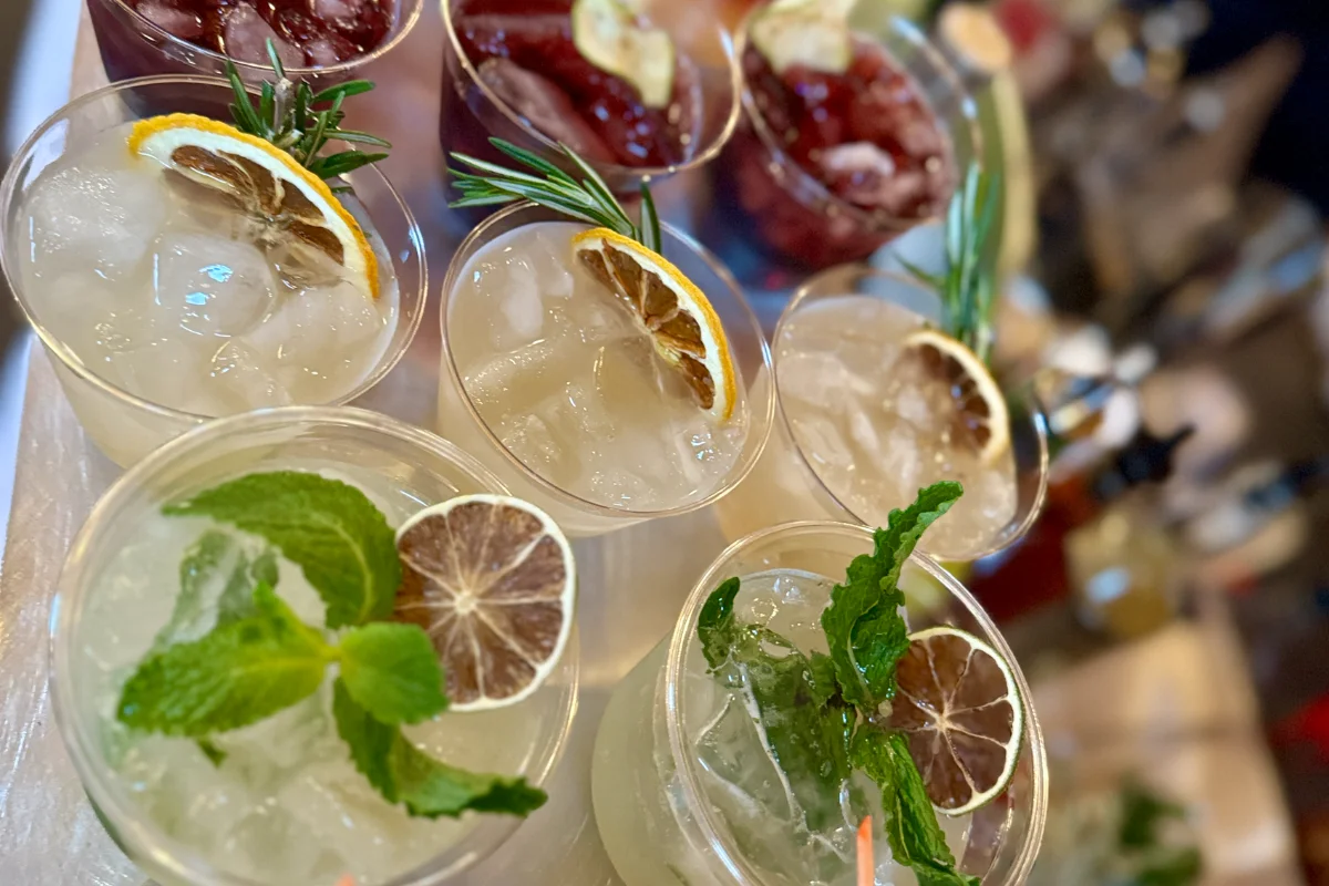 Bars on Wheels refreshing cocktails with citrus and herb garnishes served at stylish event bar setup