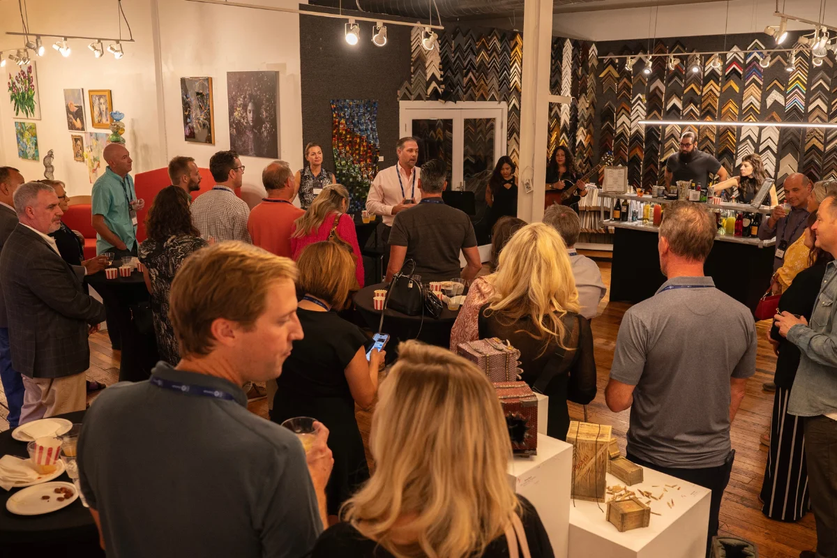 Bars on Wheels indoor corporate event with guests enjoying drinks at mobile bar service setup