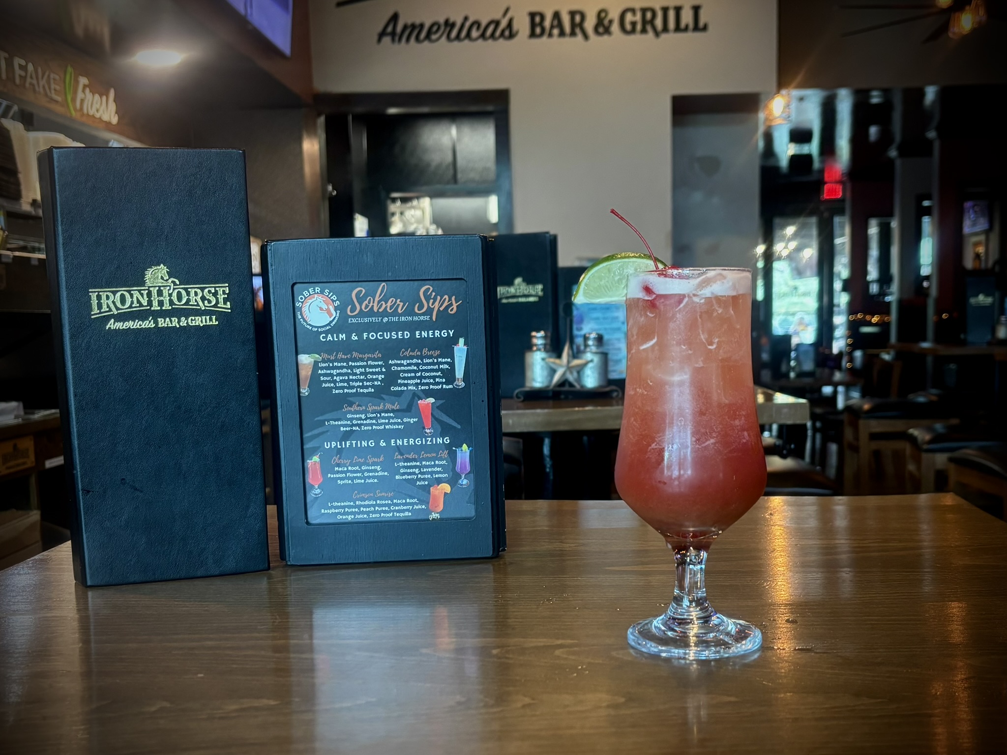 Bright cherry and lime zero-proof cocktail with maca root and ginseng for natural stamina and mood boost.