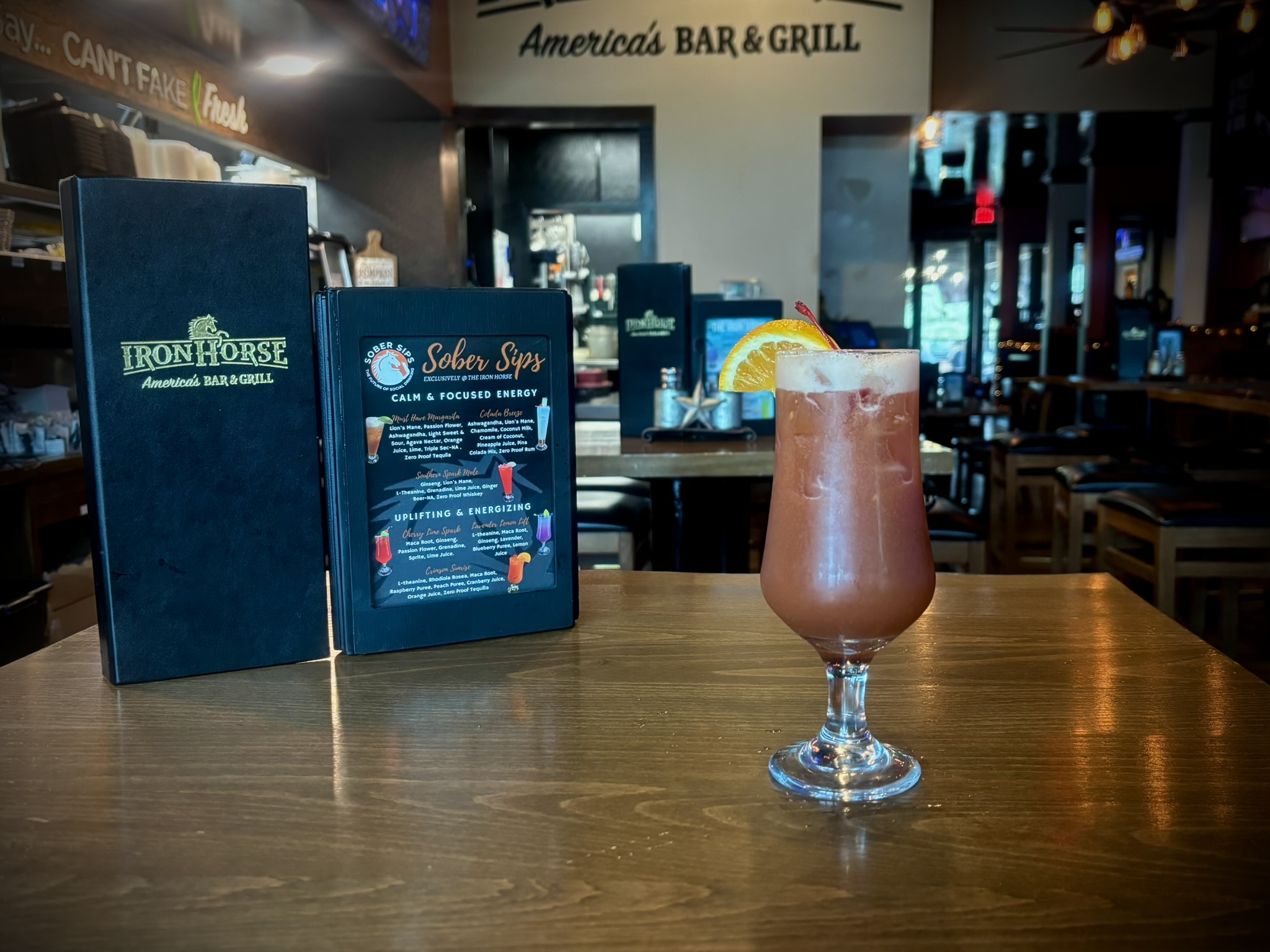 Vibrant raspberry, peach, and cranberry zero-proof tequila cocktail designed for sustained energy and mental clarity.
