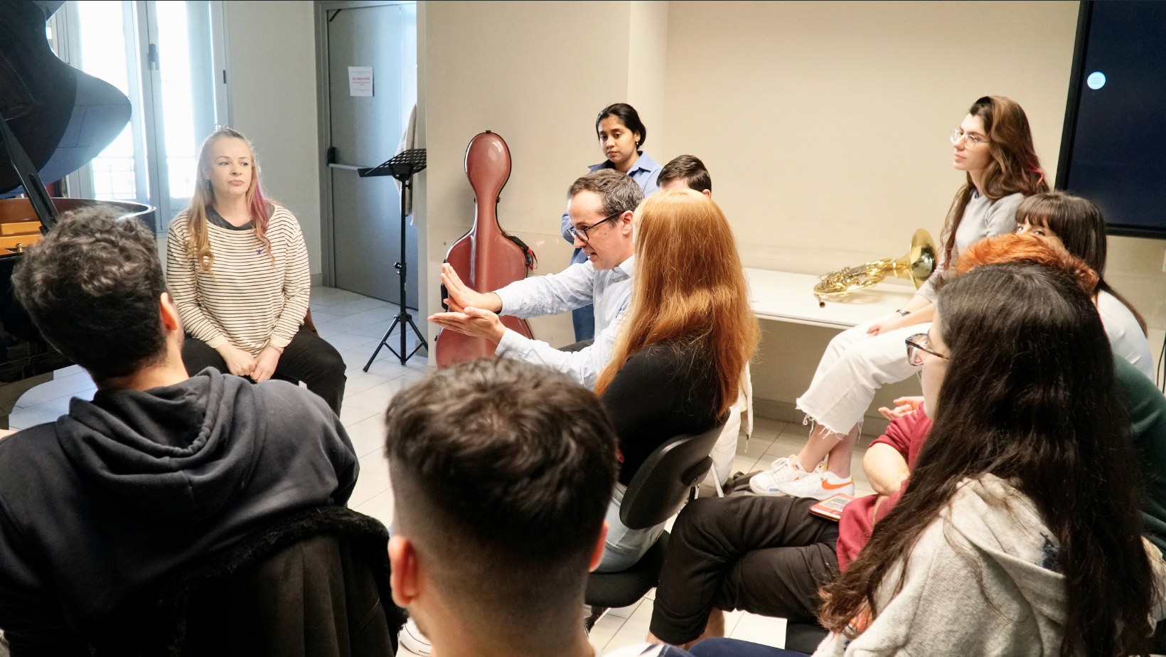 Cristo Barrios working with a group of performers