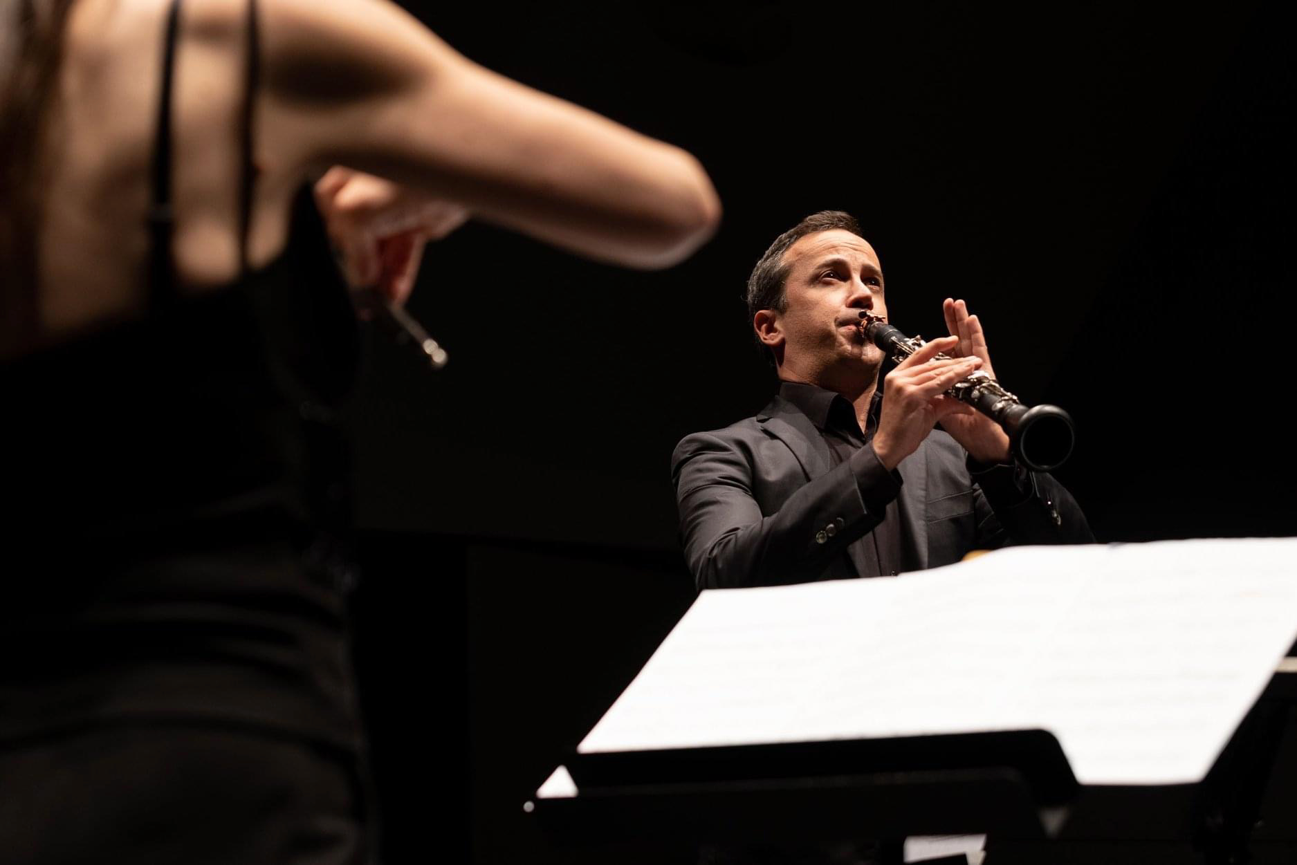 Cristo Barrios performing on clarinet in a chamber music setting
