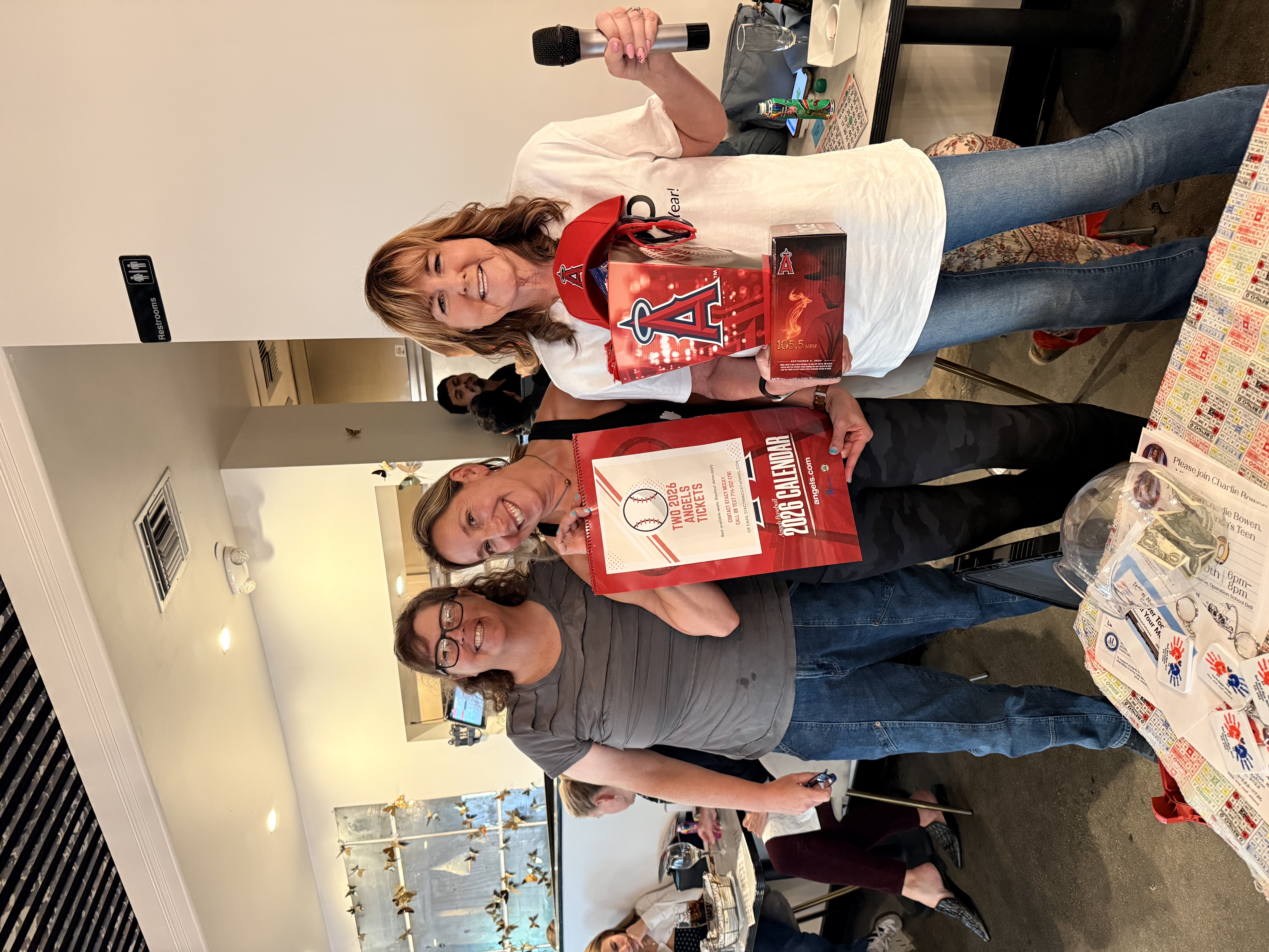 Kim with Bingo winners holding Angels prize basket