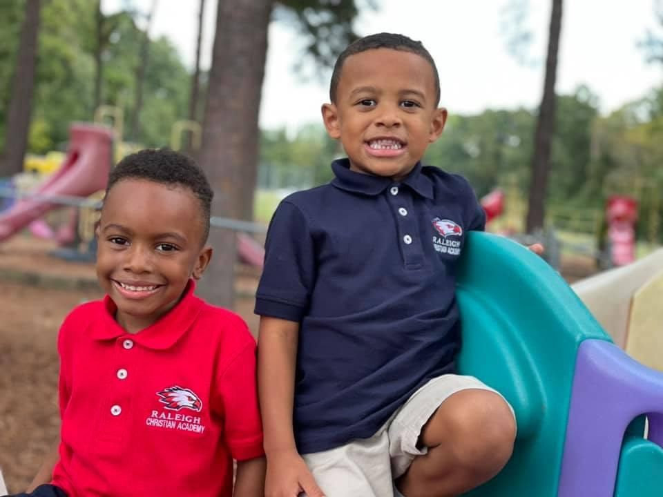 Two young boys smiling
