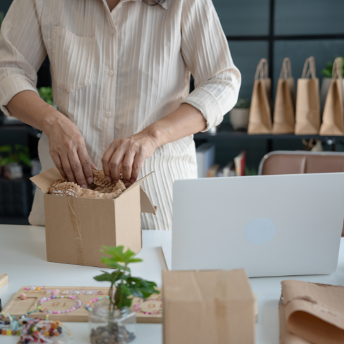 Business owner preparing a package for shipping