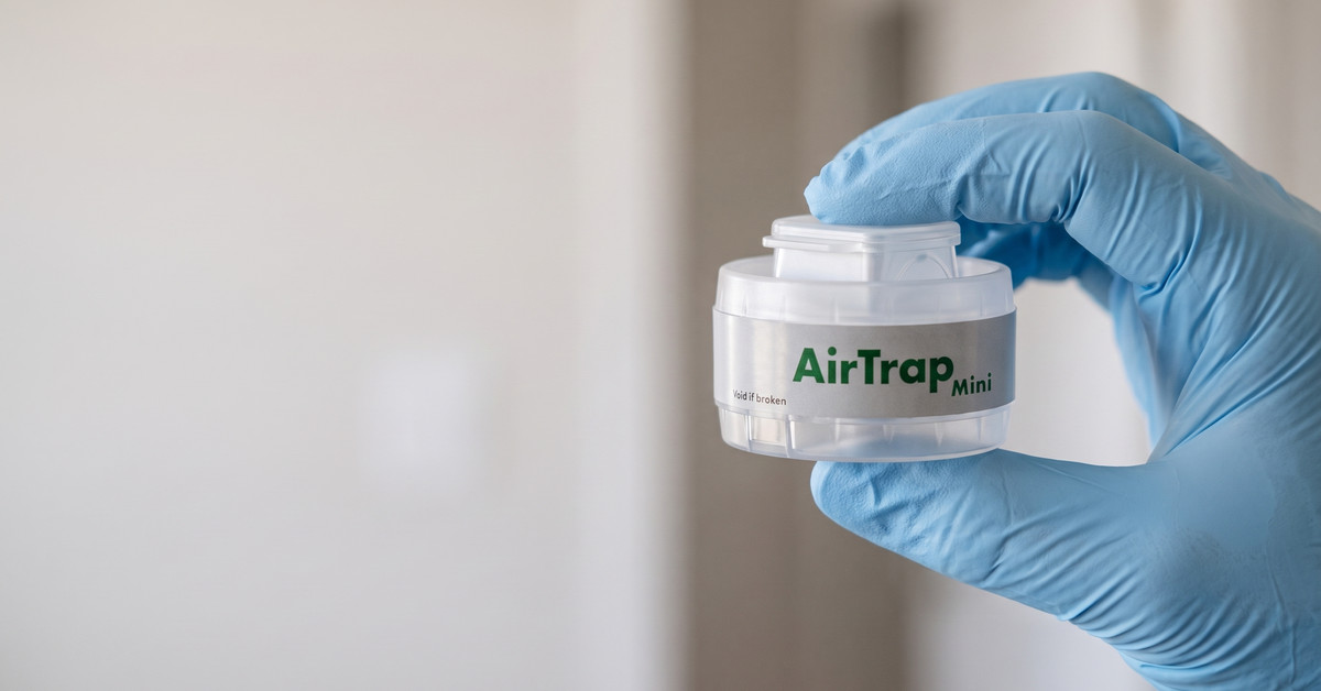 AirTrap Mini spore trap held in a gloved hand