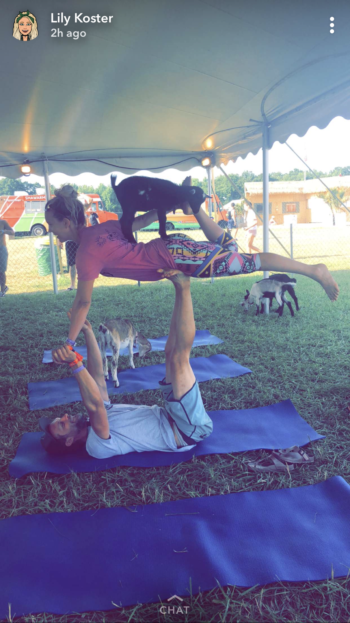 Lily at the music festival doing goat yoga with Laura Ritter