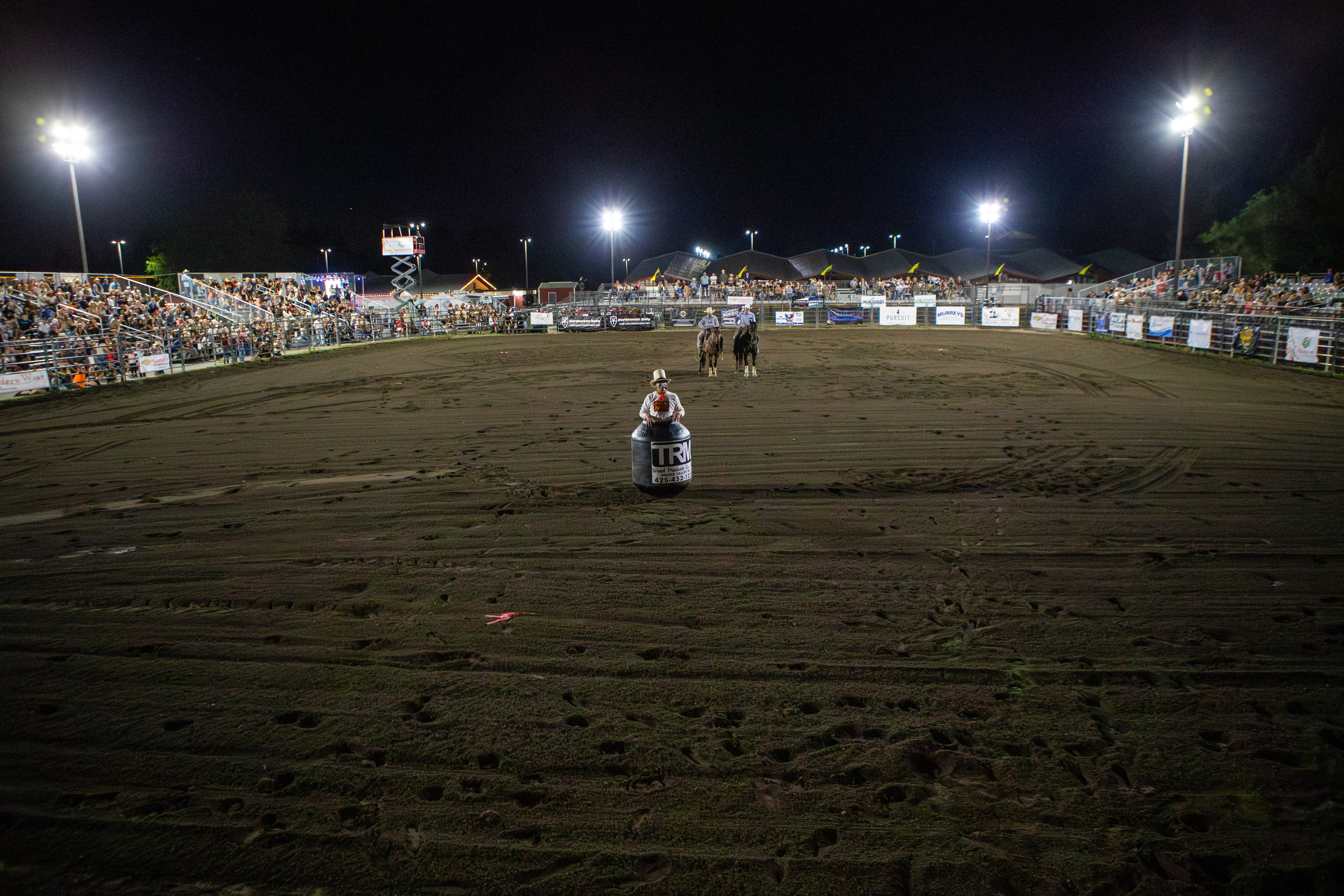 Wide view of a working rodeo arena.