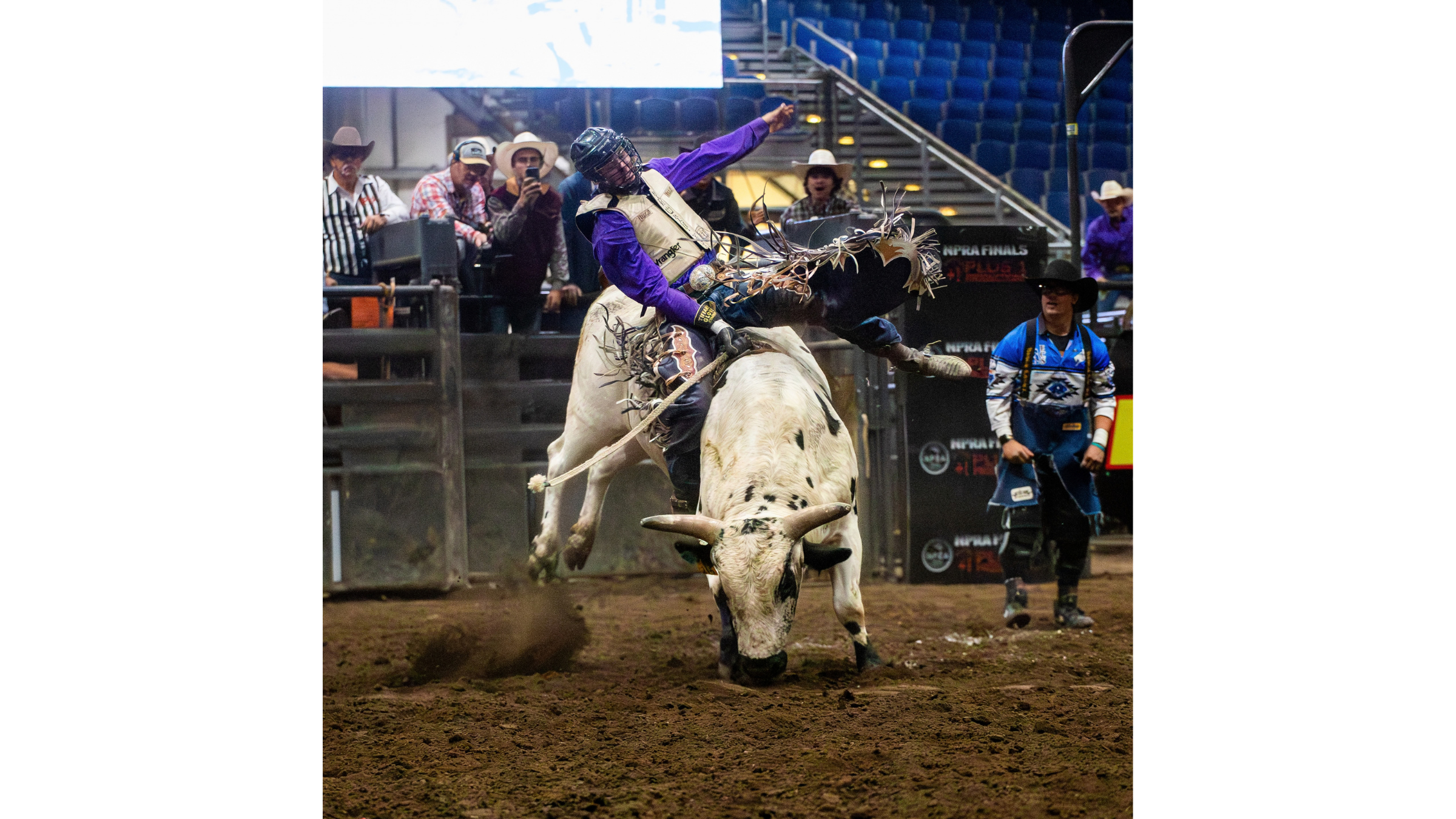 Rodeo action photographed at a high ISO in an indoor arena. Rodeo action photographed at a high ISO in an indoor arena.