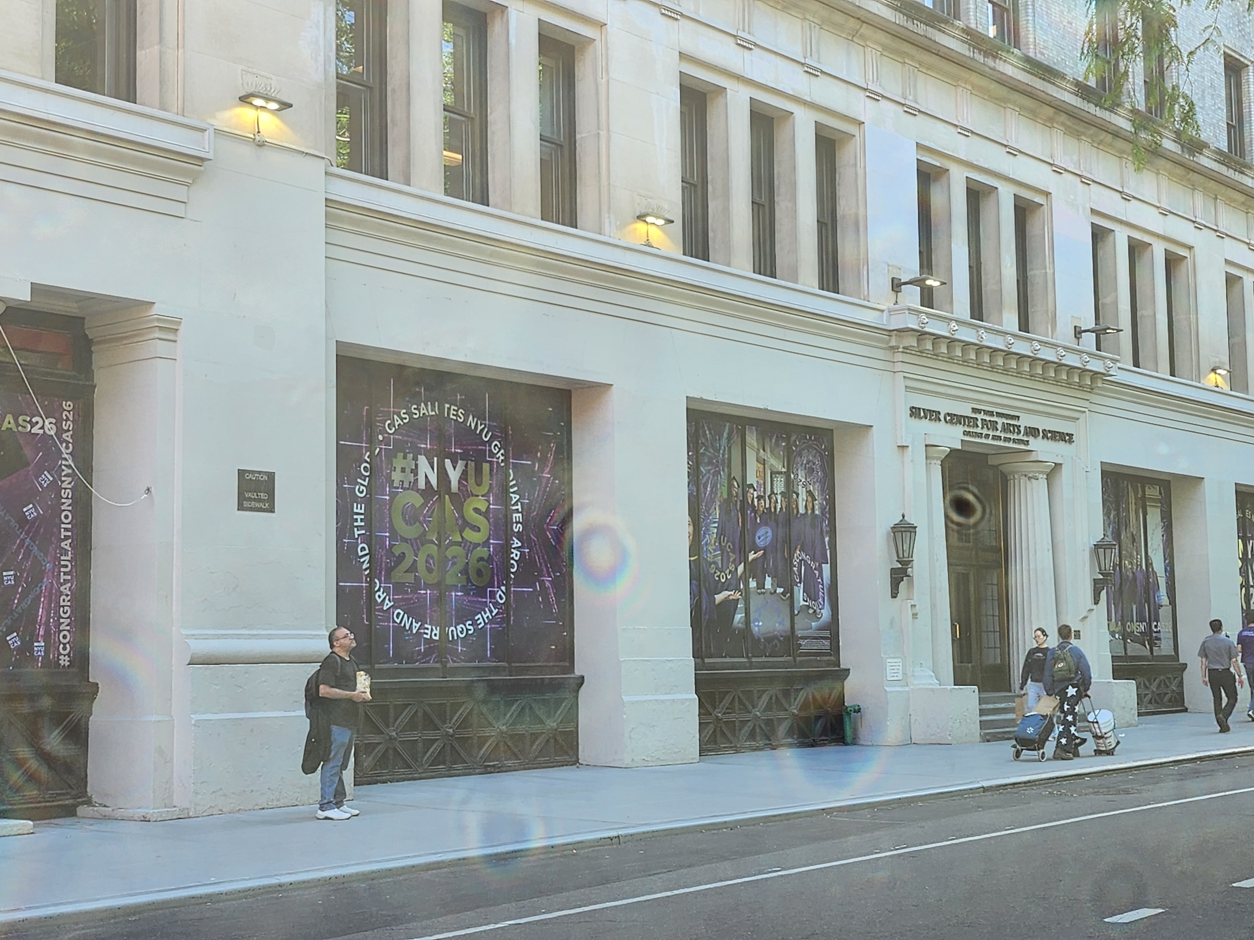 NYU Silver Center for Arts and Science entrance with class of 2026 window graphics NYU Silver Center for Arts and Science entrance with class of 2026 window graphics