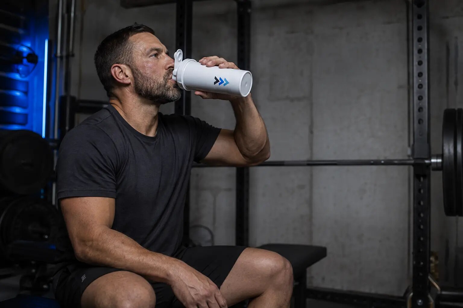 Athlete drinking from an AMF shaker between training sets