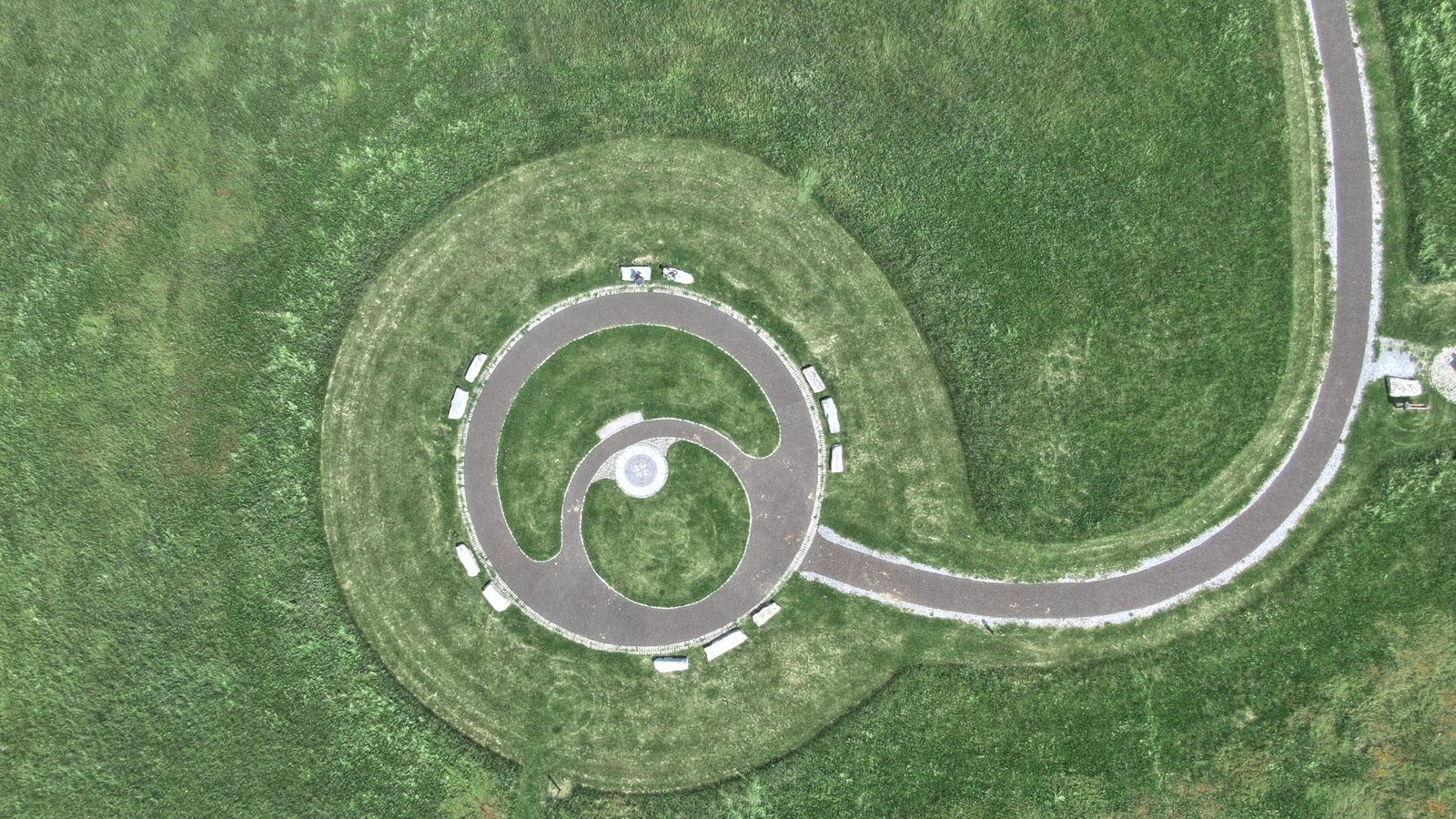 Top-down aerial photo of the winding paved trail up to the summit of Highpoint Scenic Vista