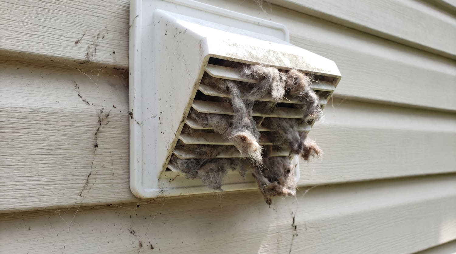 Lint built up inside a clothes dryer vent duct