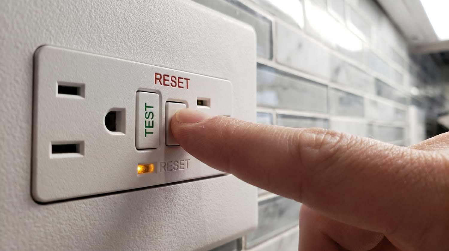 GFCI outlet with Test and Reset buttons in a kitchen