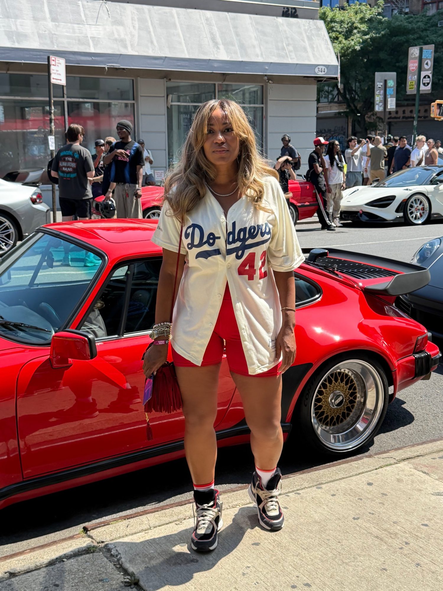 Monique D. Hayes with a vintage red Porsche