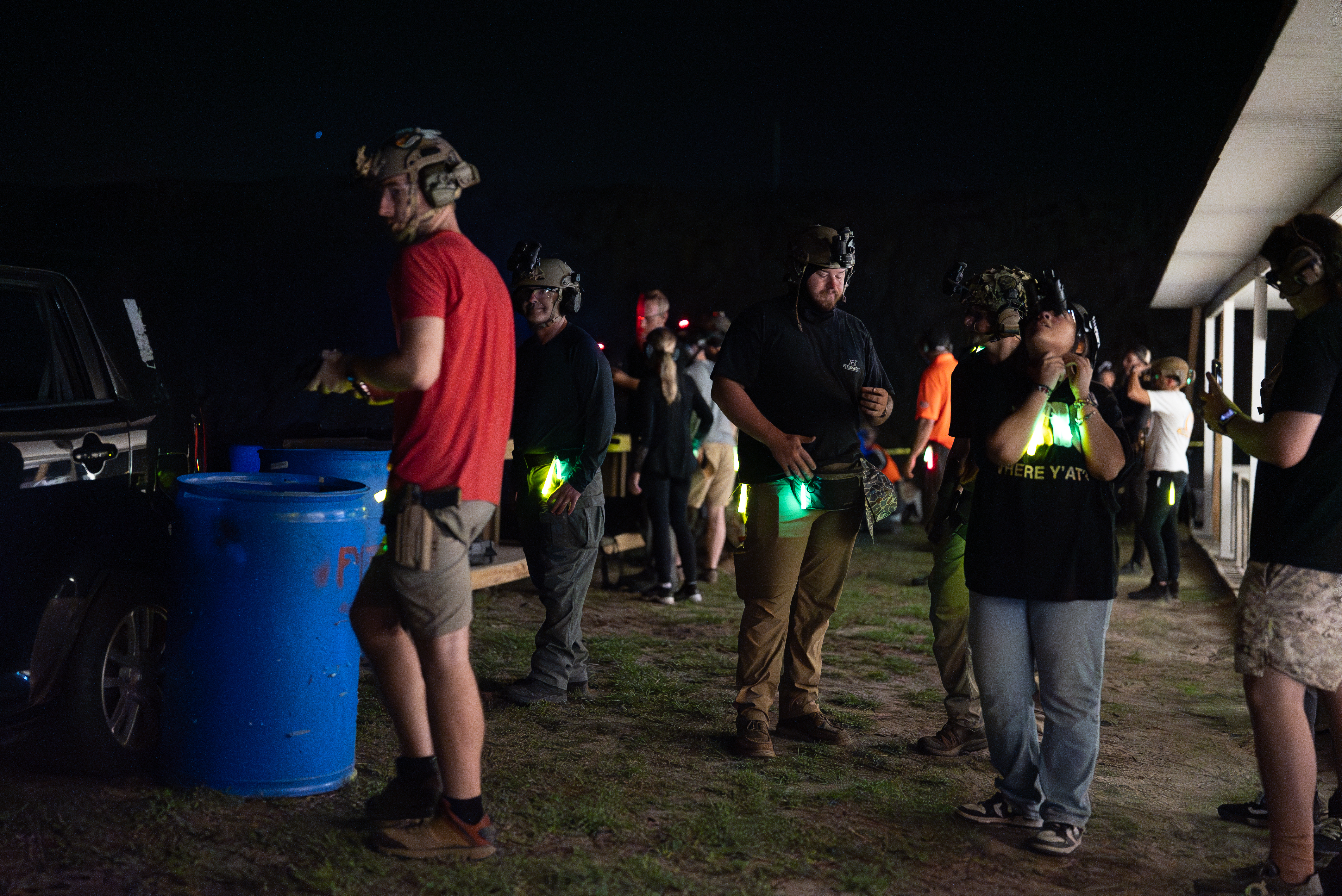 Shooters gathered at a night event