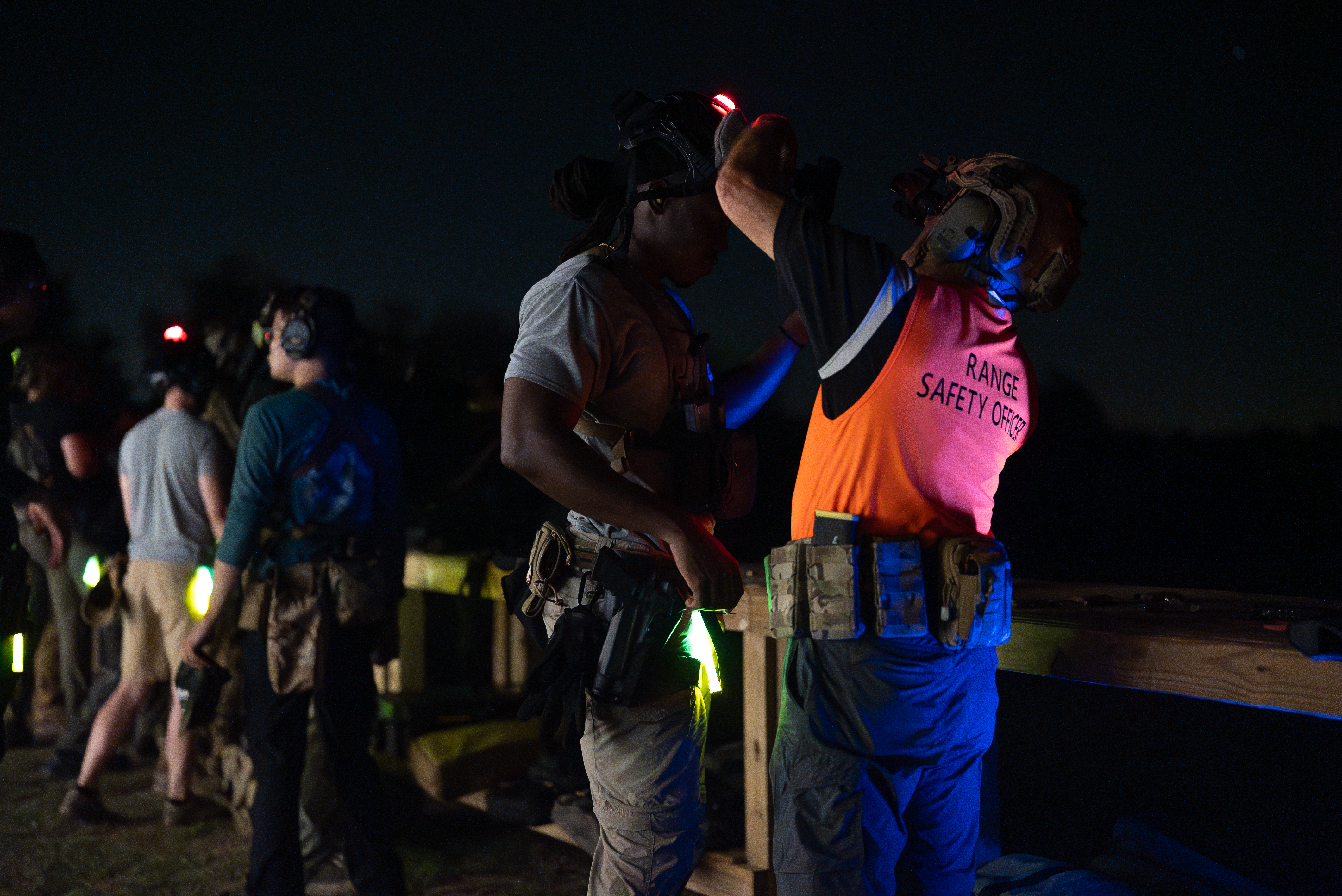 Competitors staging at dusk for the Florida Night Ruck and Shoot