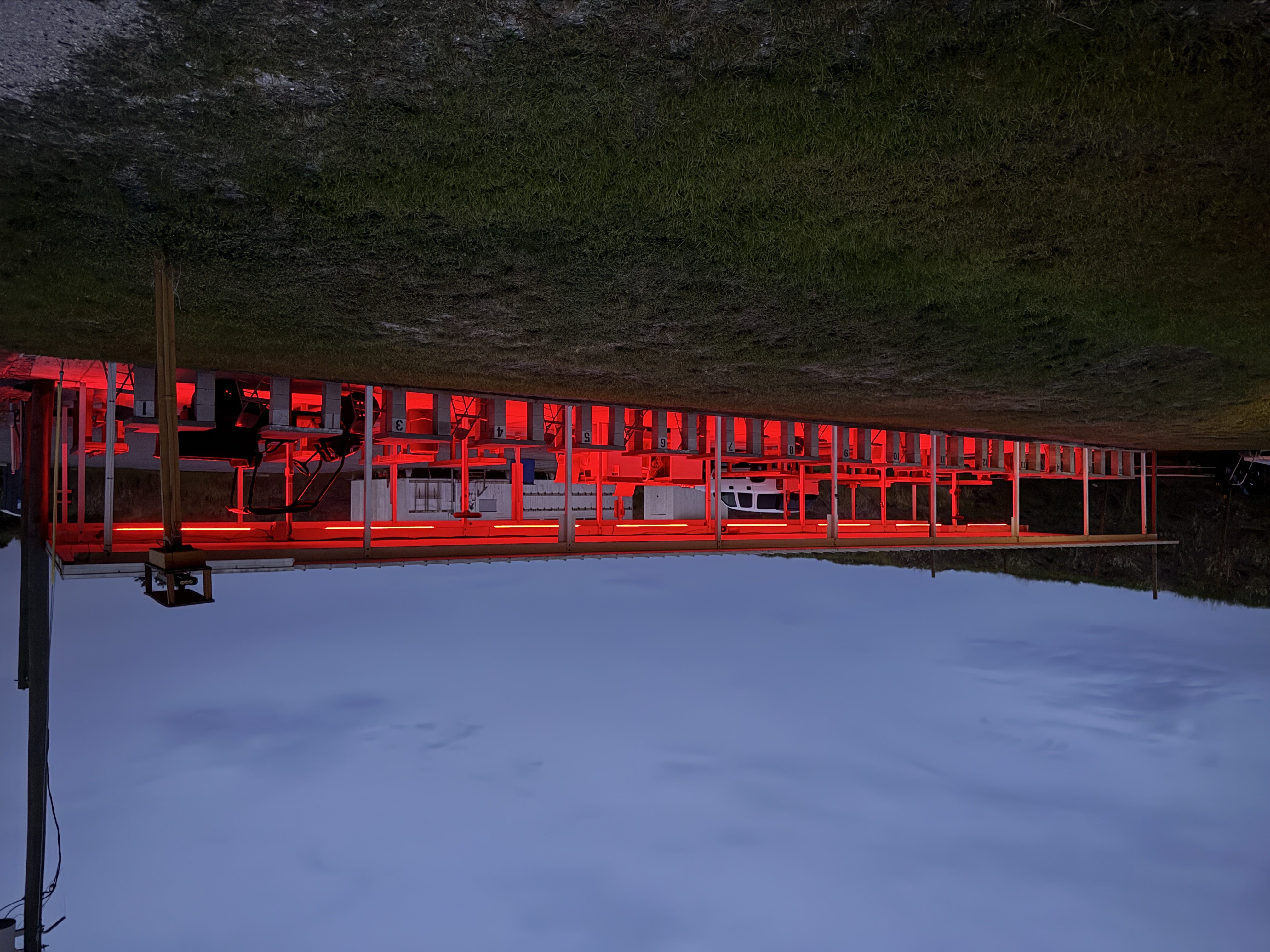 MGAC firing line under red light at night
