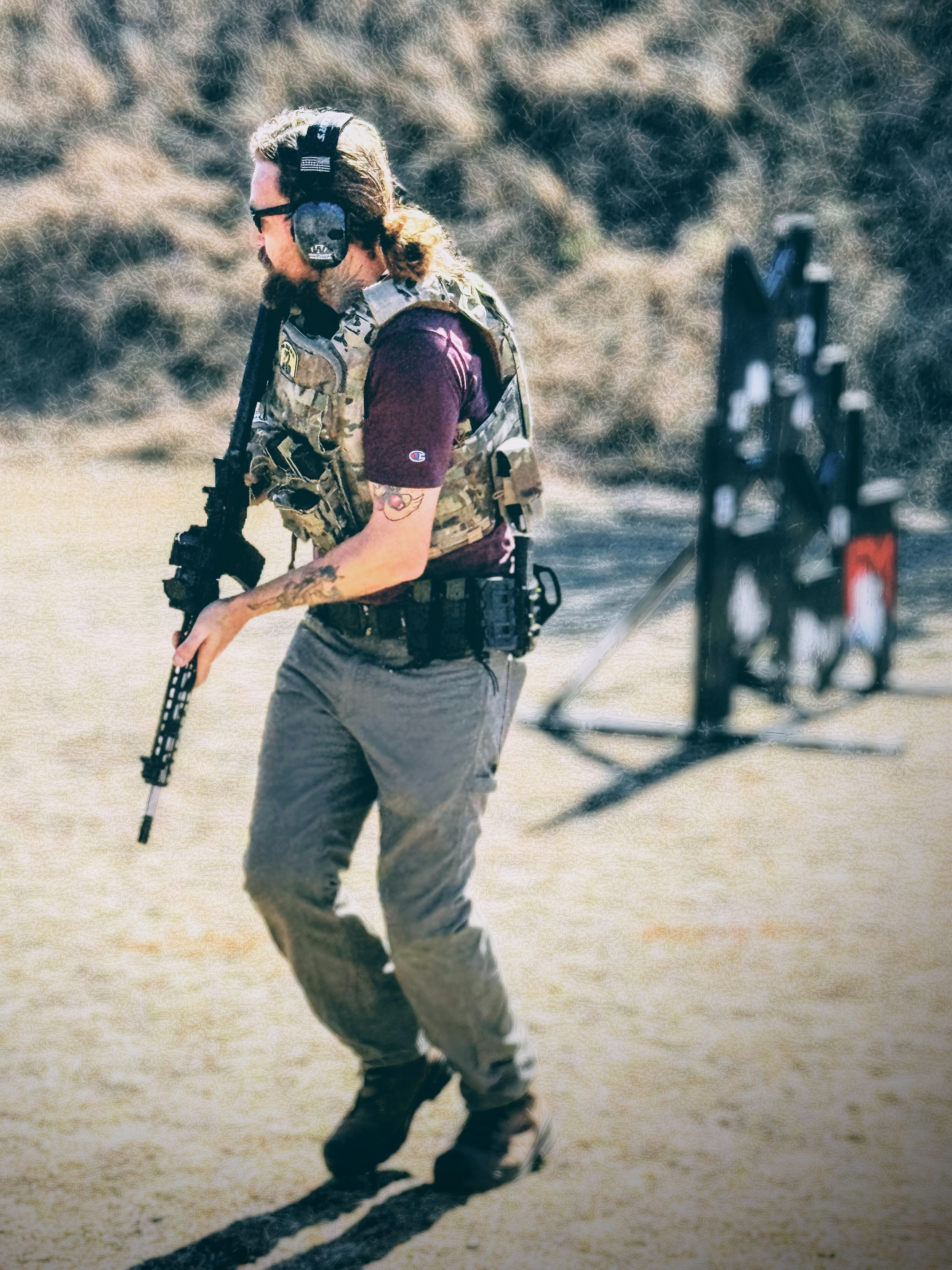 Competitor moving between stages at an MGAC multigun match