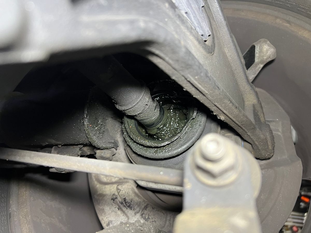 Picture of a Volvo cv axle boot leaking grease