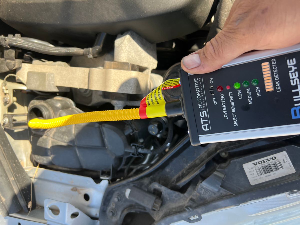 Tool being used on a Volvo to test for combustion gas reading high