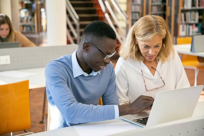 Happy student learning online with certified teacher at Tuff AI Learning Academy