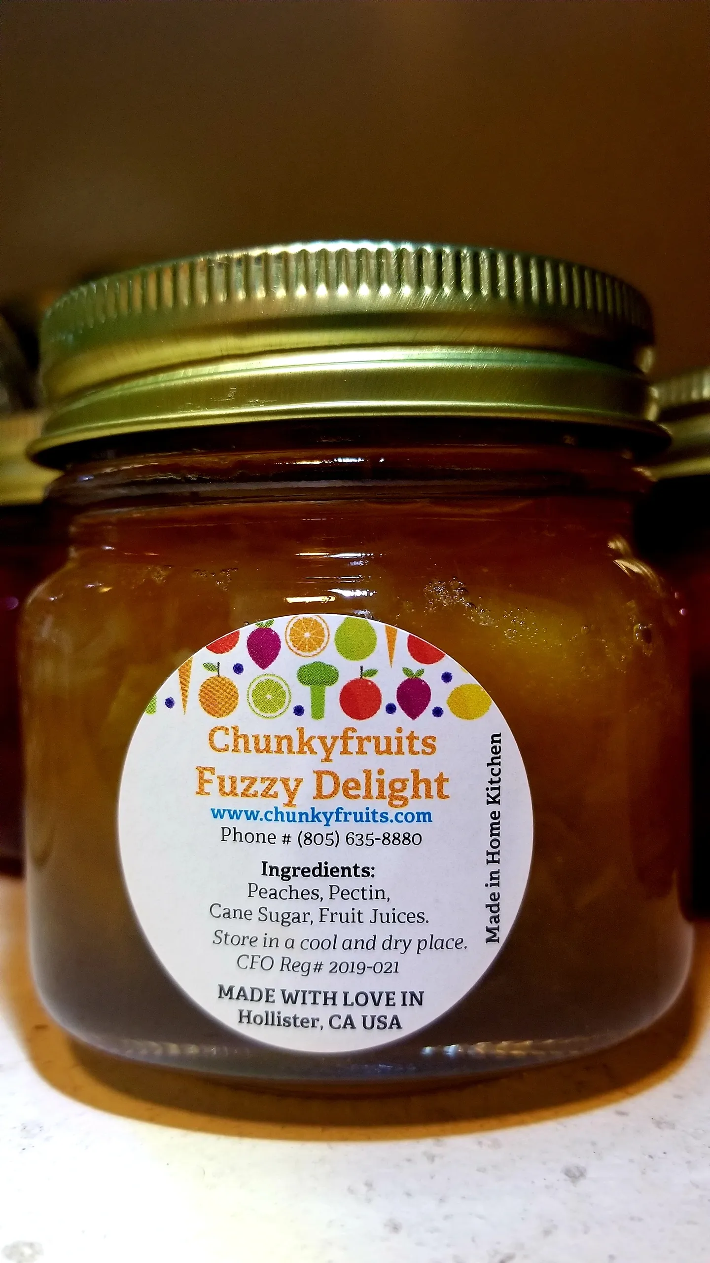 Labeled Fuzzy Delight peach jam jar