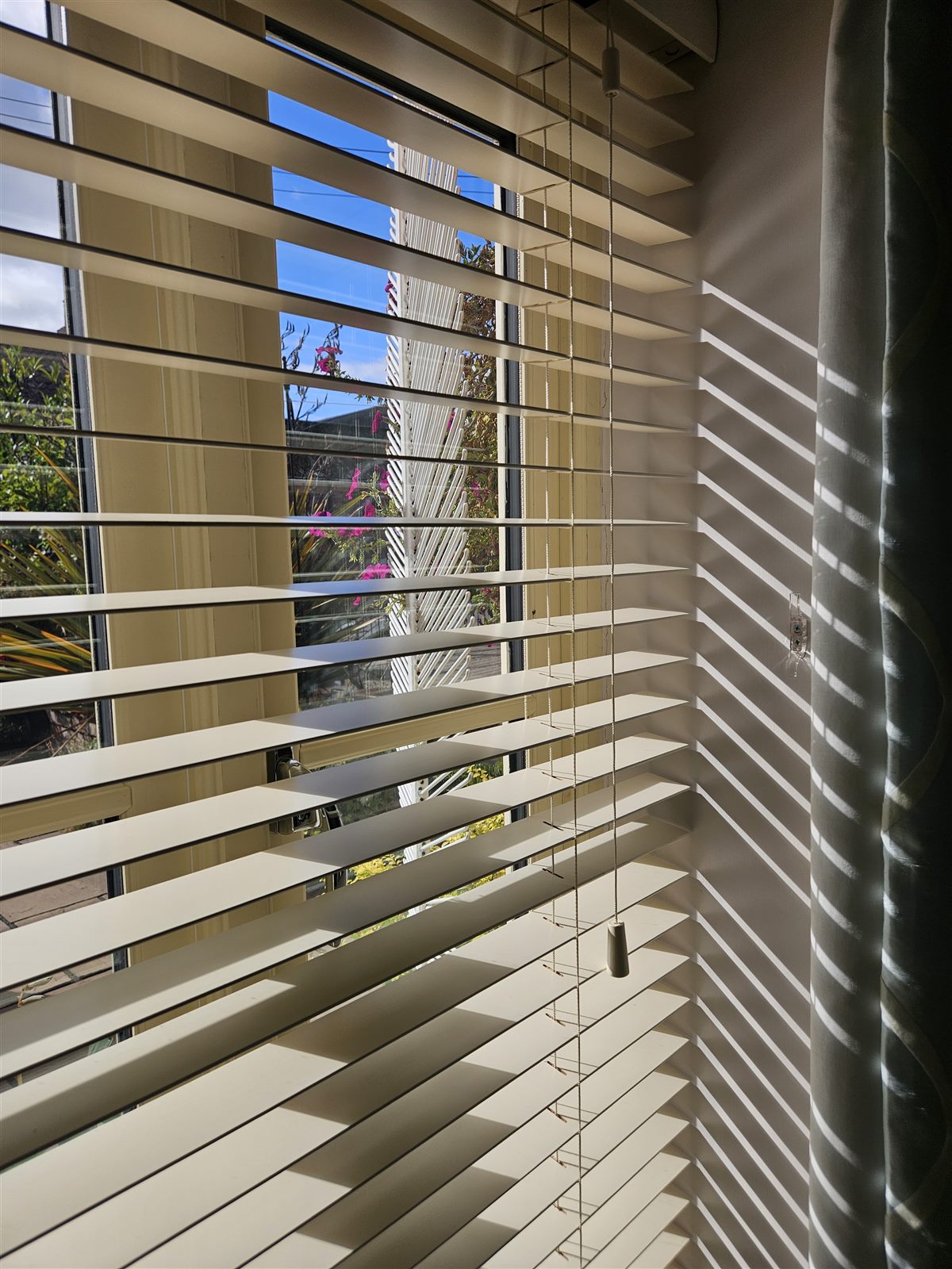 Close-up of cream real wood venetian blind slats fitted by Eclipse SBC in Retford
