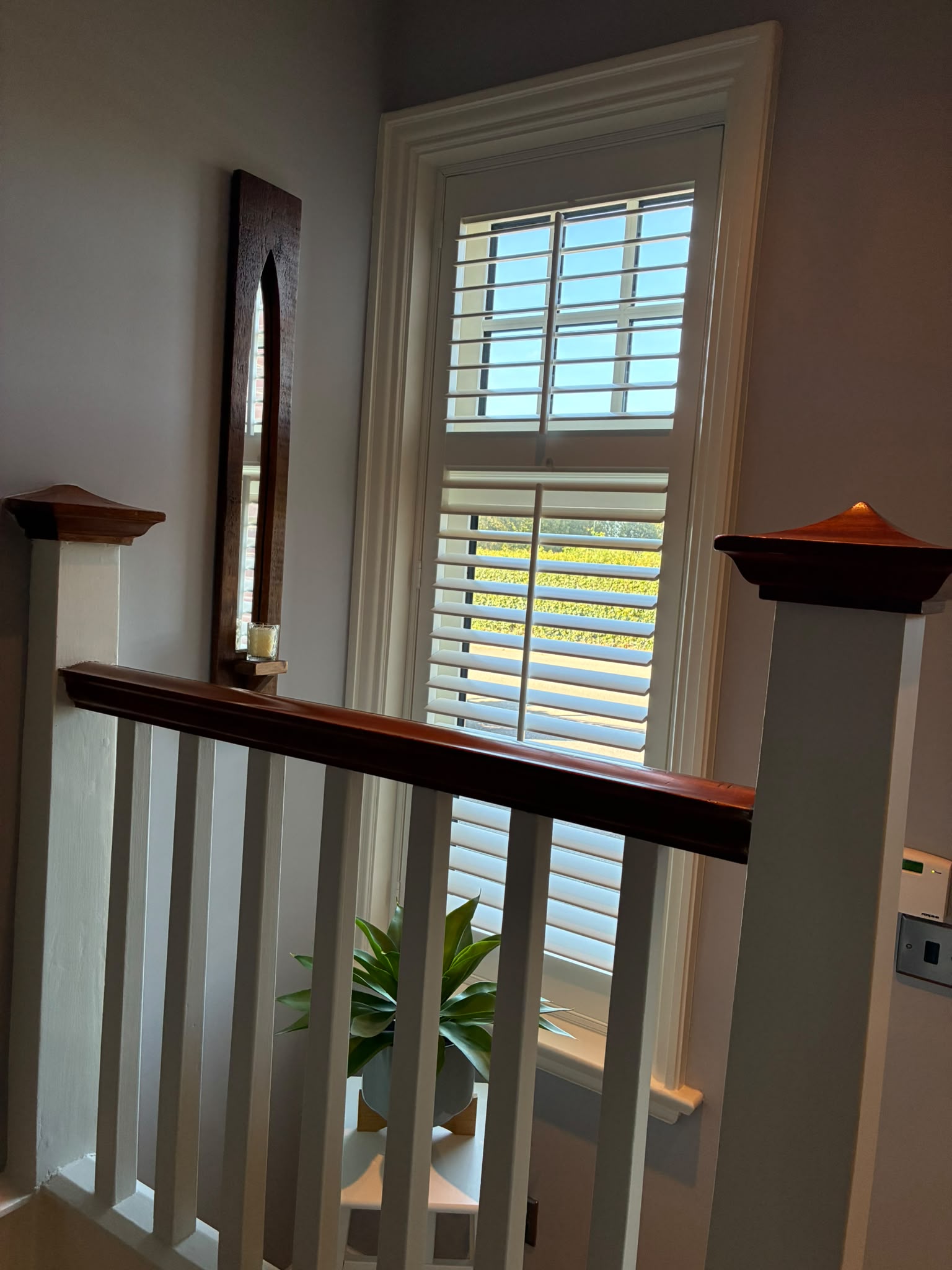 Full height plantation shutters with a mid rail on an Edwardian hallway window, painted in Farrow and Ball Wimborne White by Eclipse SBC Full height plantation shutters with a mid rail on an Edwardian hallway window, painted in Farrow and Ball Wimborne White by Eclipse SBC