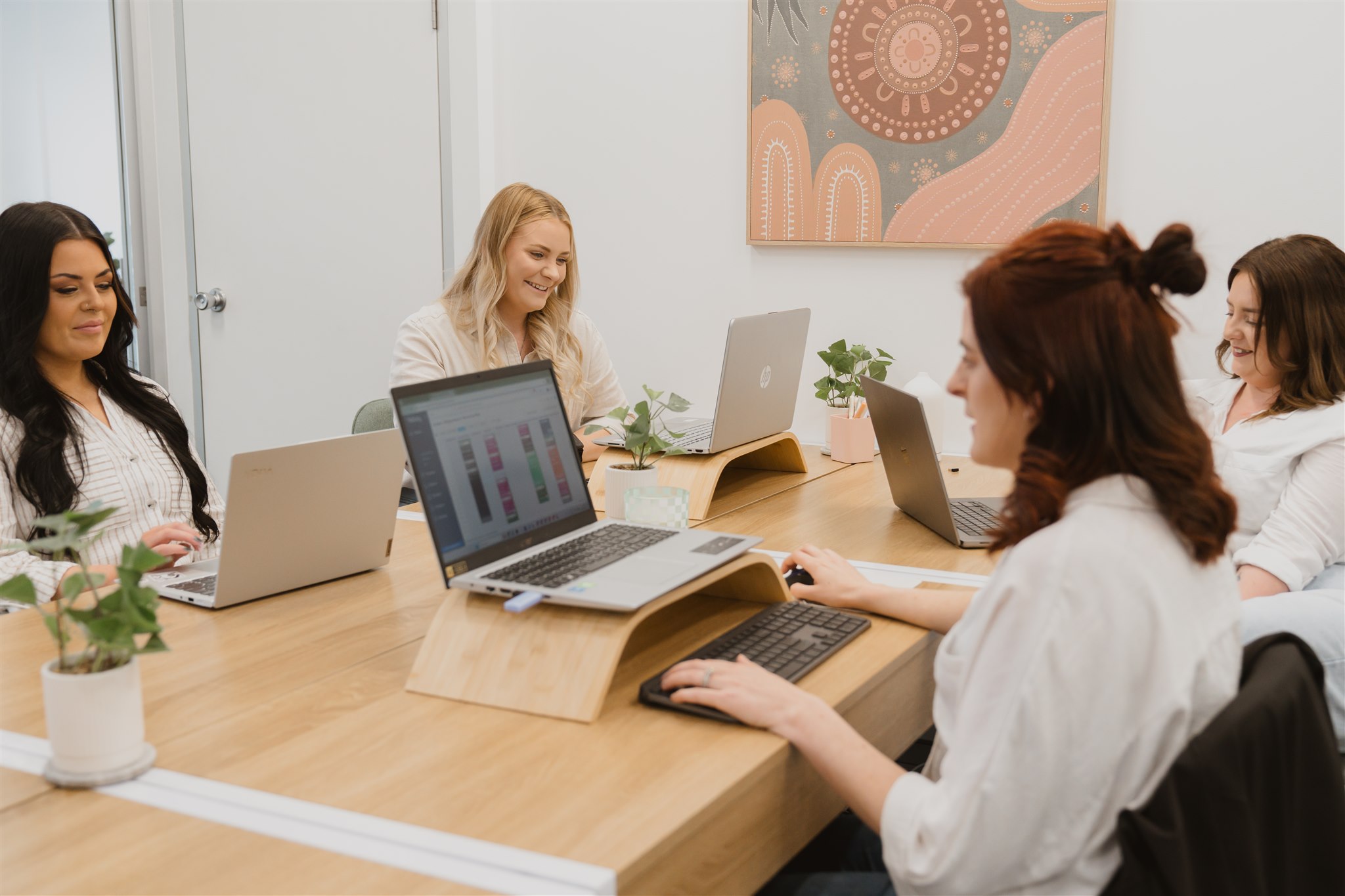 The SPM team collaborating at a table — allied health practice management specialists