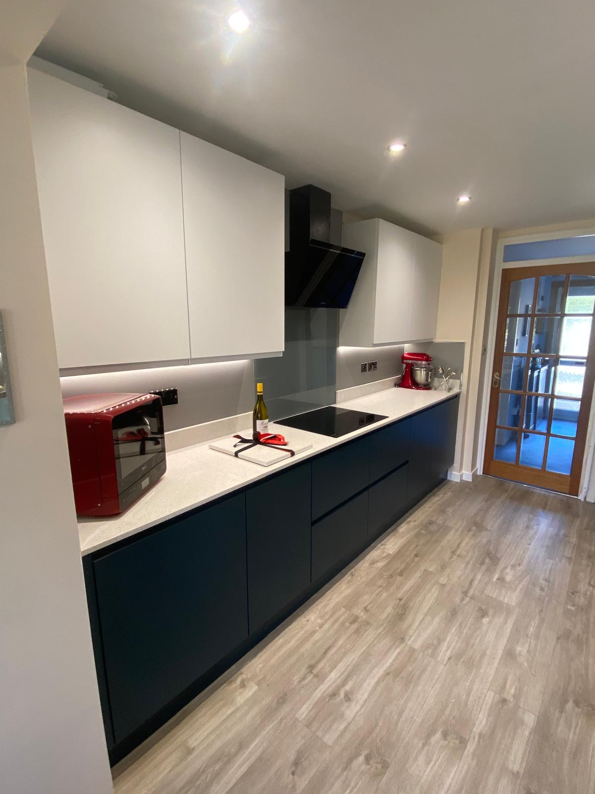 Kitchen after: white and navy handleless refresh
