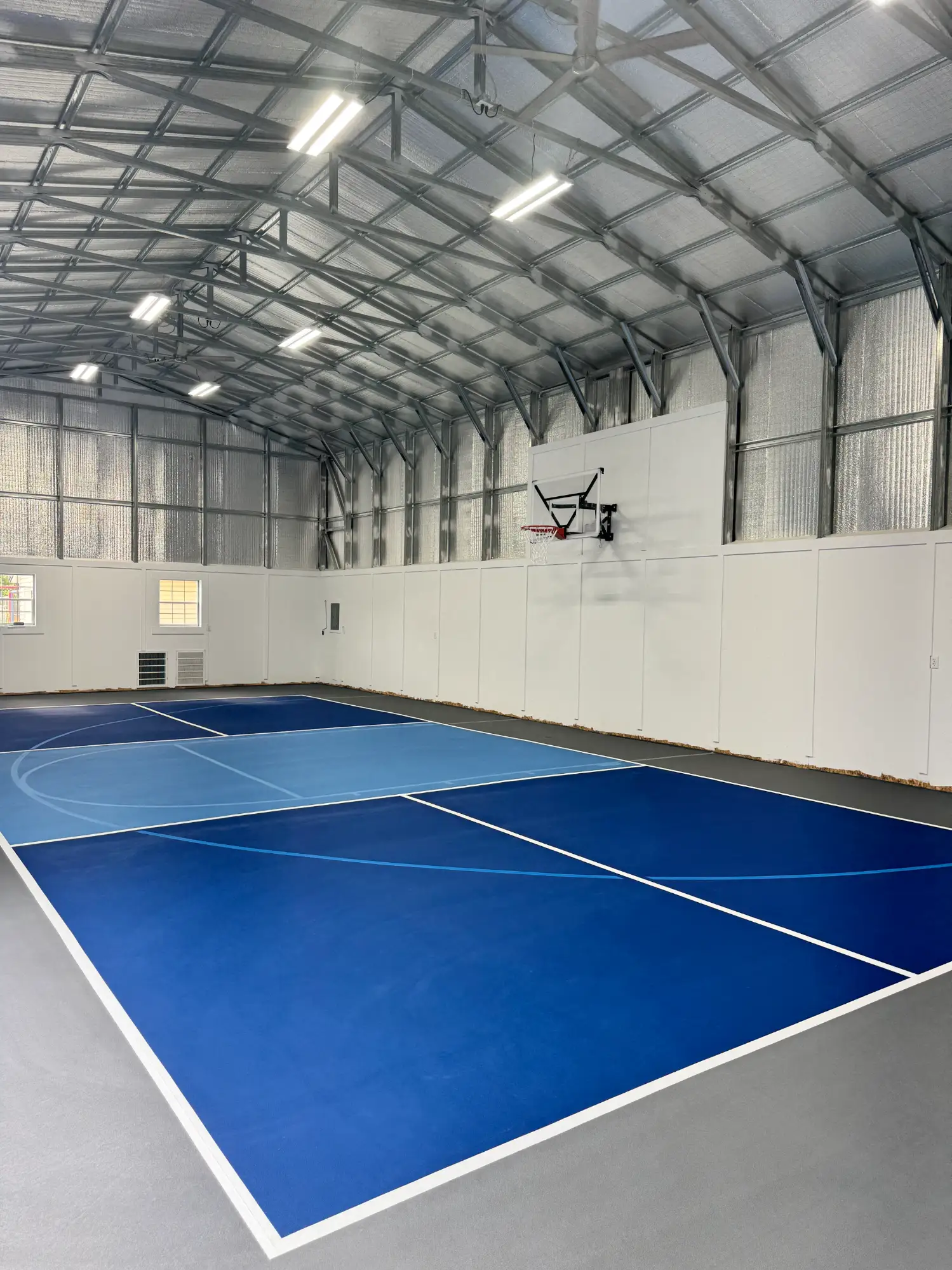 Indoor multicourt with blue and light blue color combination