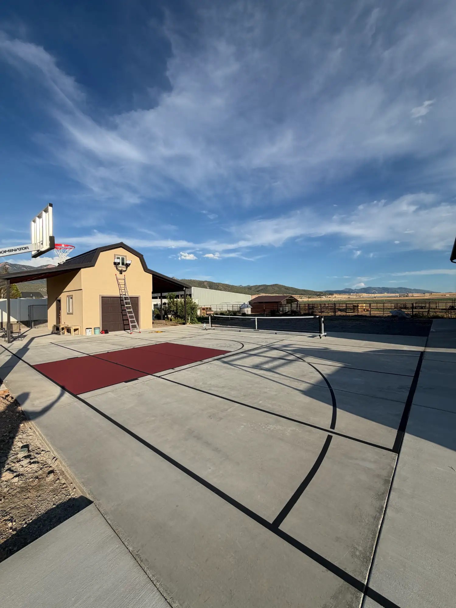 Backyard pickleball and basketball court combination