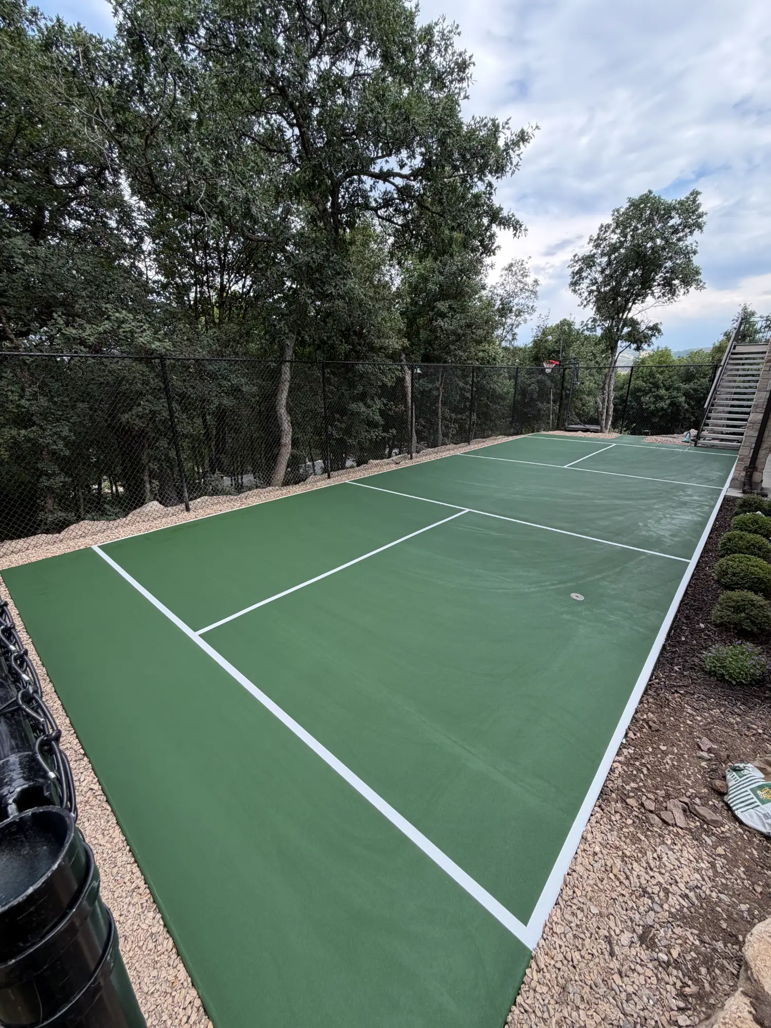 Outdoor pickleball court with green color
