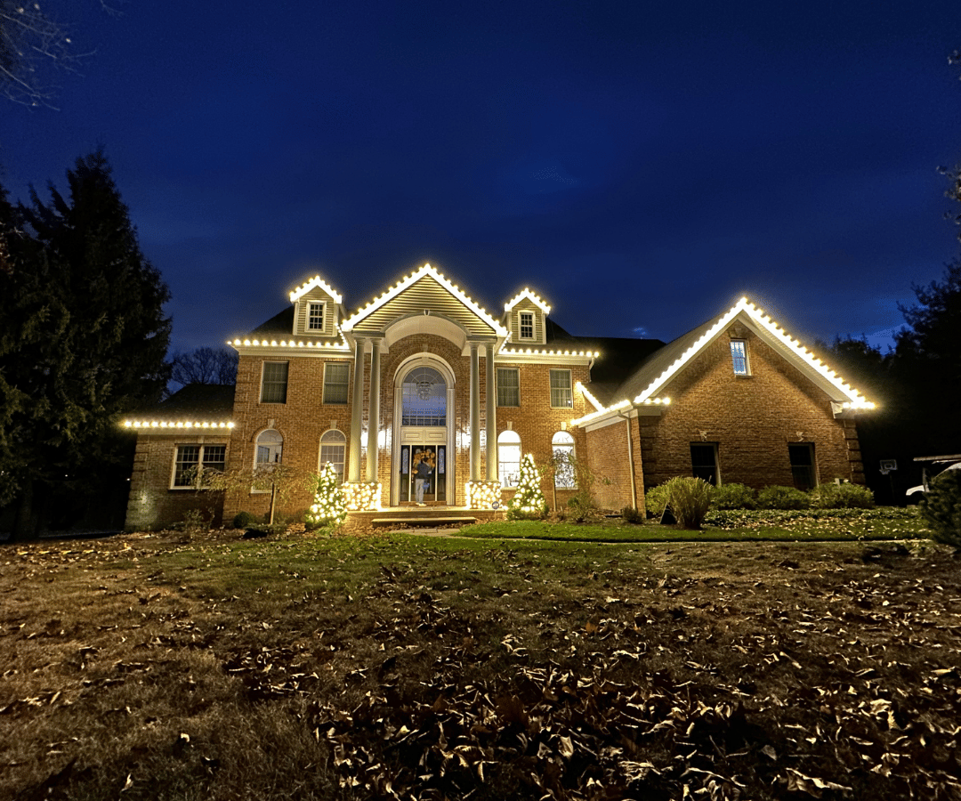 Luxury home roofline Christmas light installation by Golden Glow Christmas Lights Morris County NJ