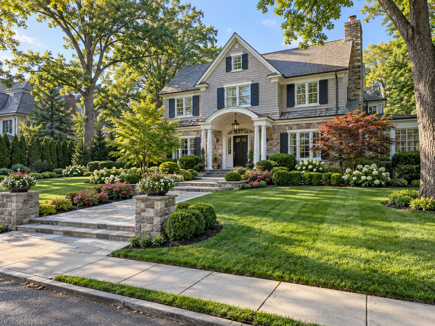 Residential street with maintained lawns and planted front gardens