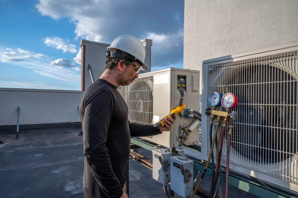 HVAC Technician inspecting air conditioning and heating system