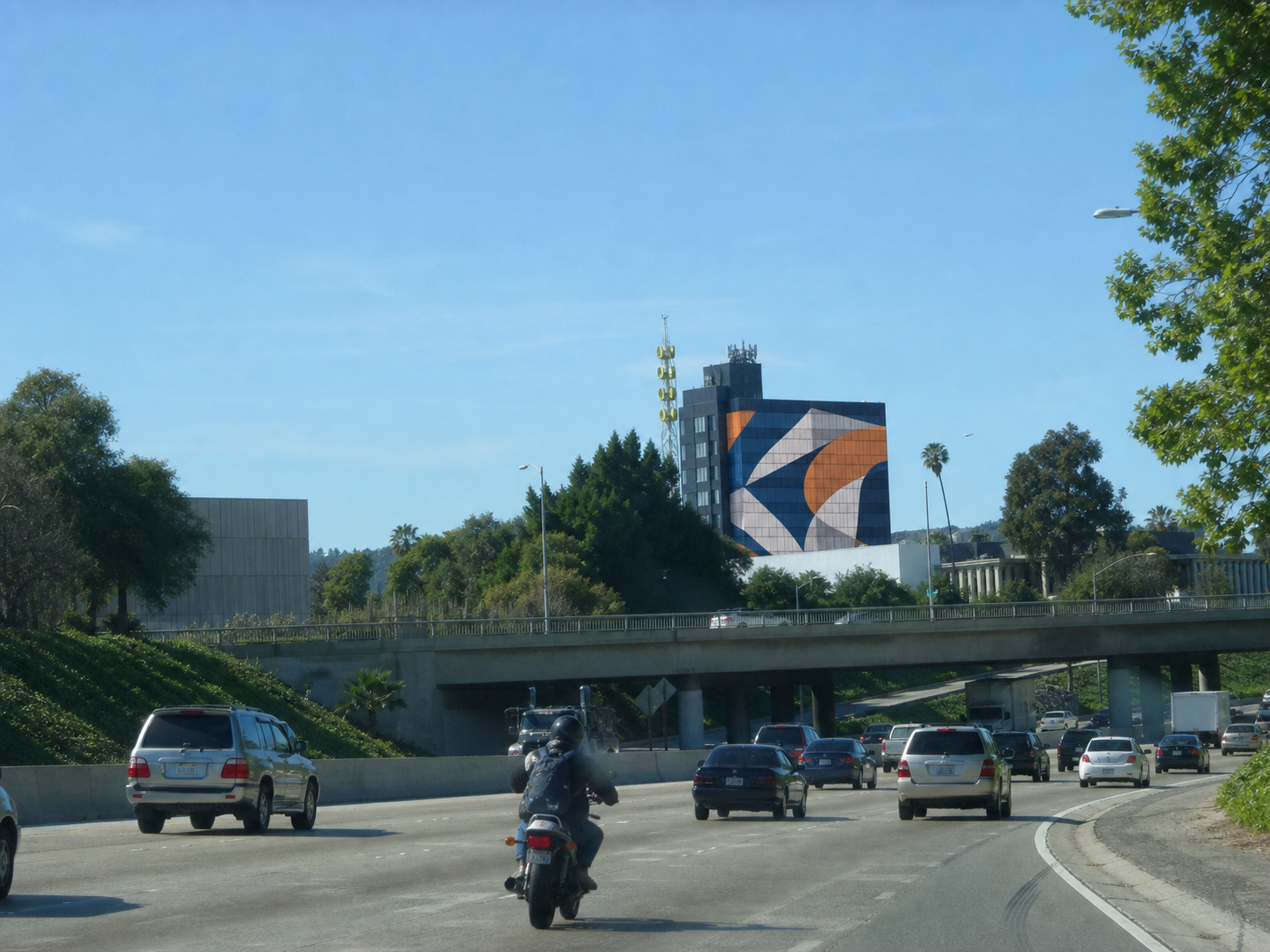 Glass tower with a large abstract supergraphic installed across the facade
