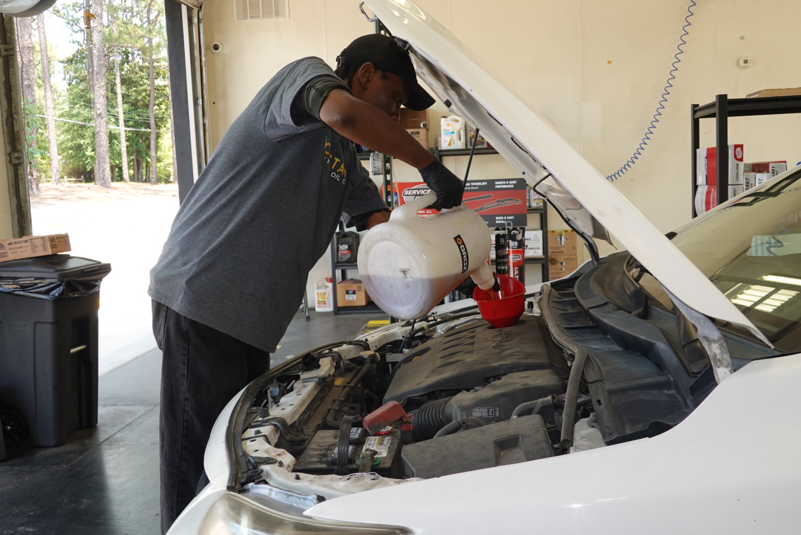 Costa Oil tech during oil change