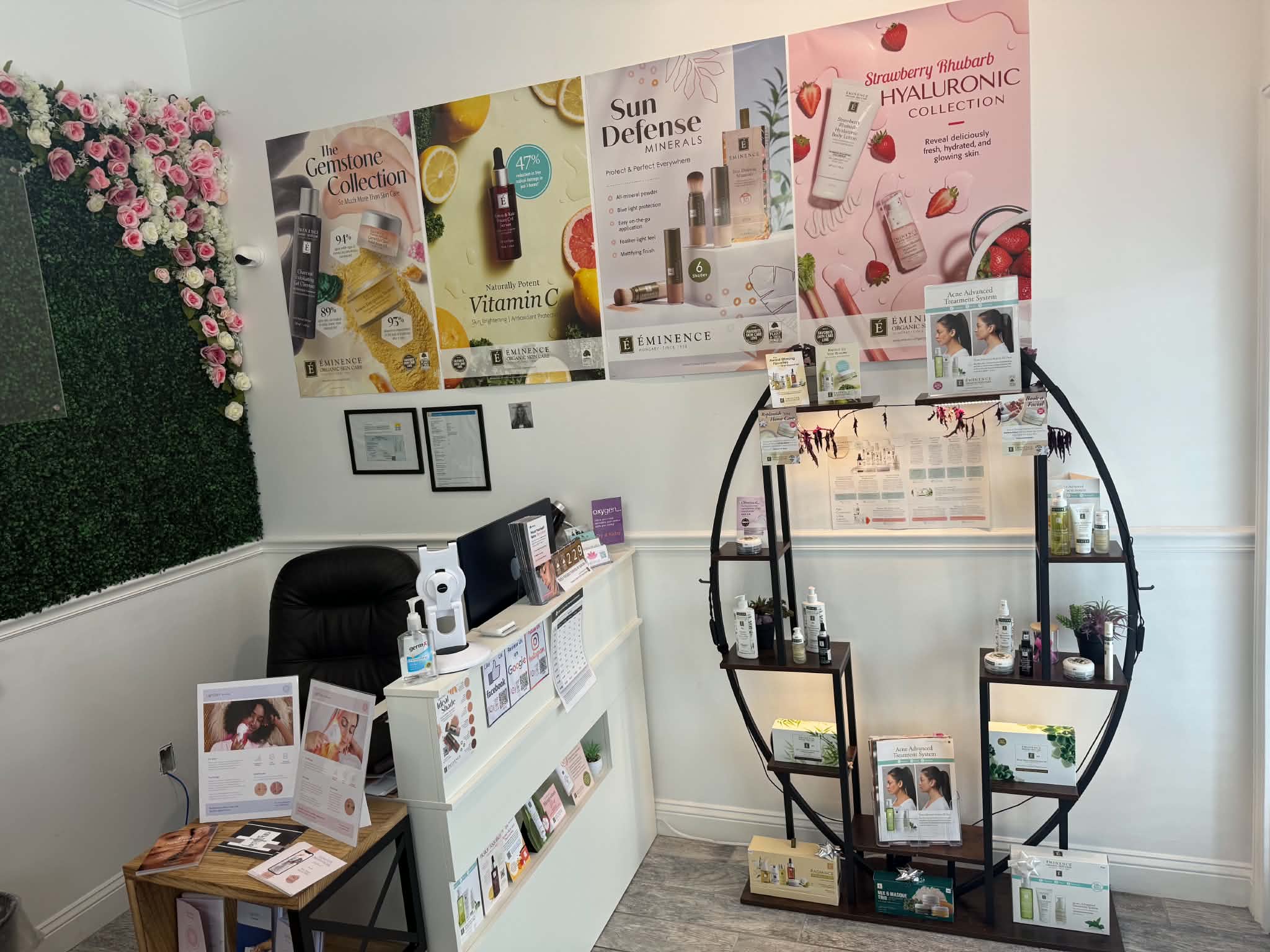 IVolve Med Spa Jacksonville treatment room interior with pink floral wall and lotus accents