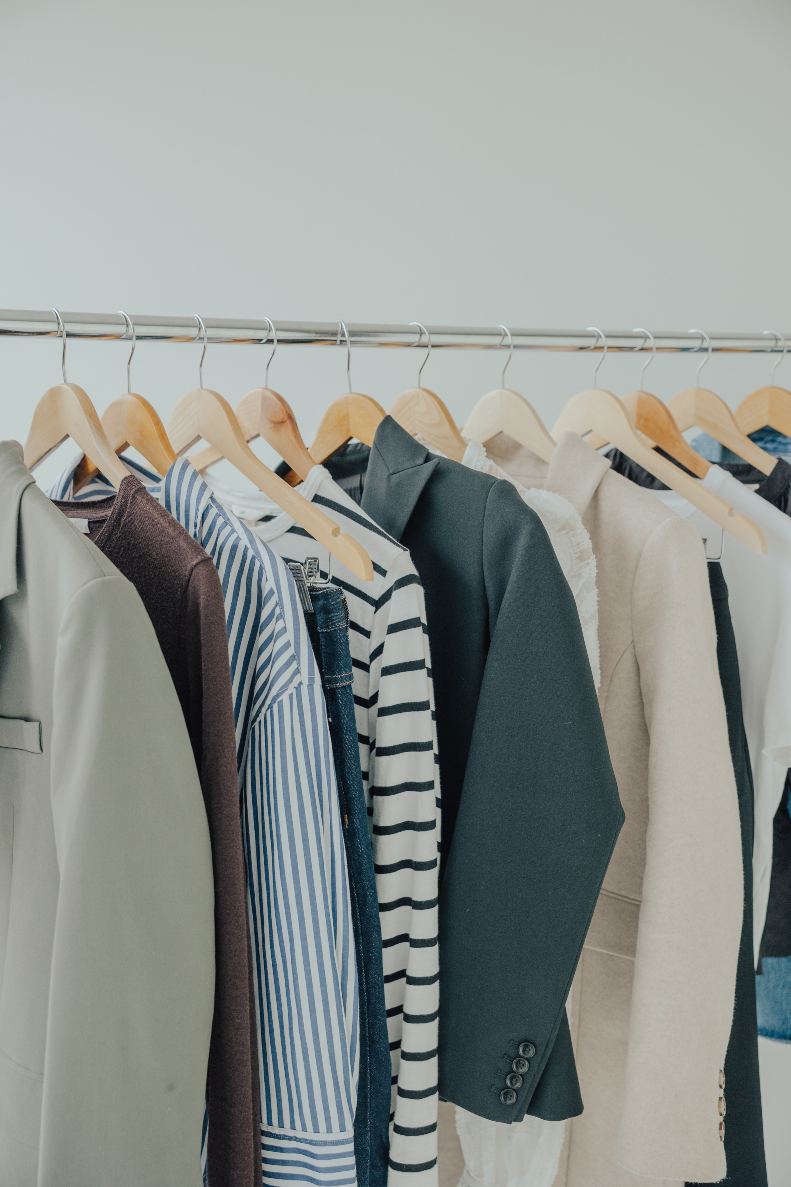 Clothing rack with blazers, shirts, and dresses prepared for Auckland wardrobe reset session
