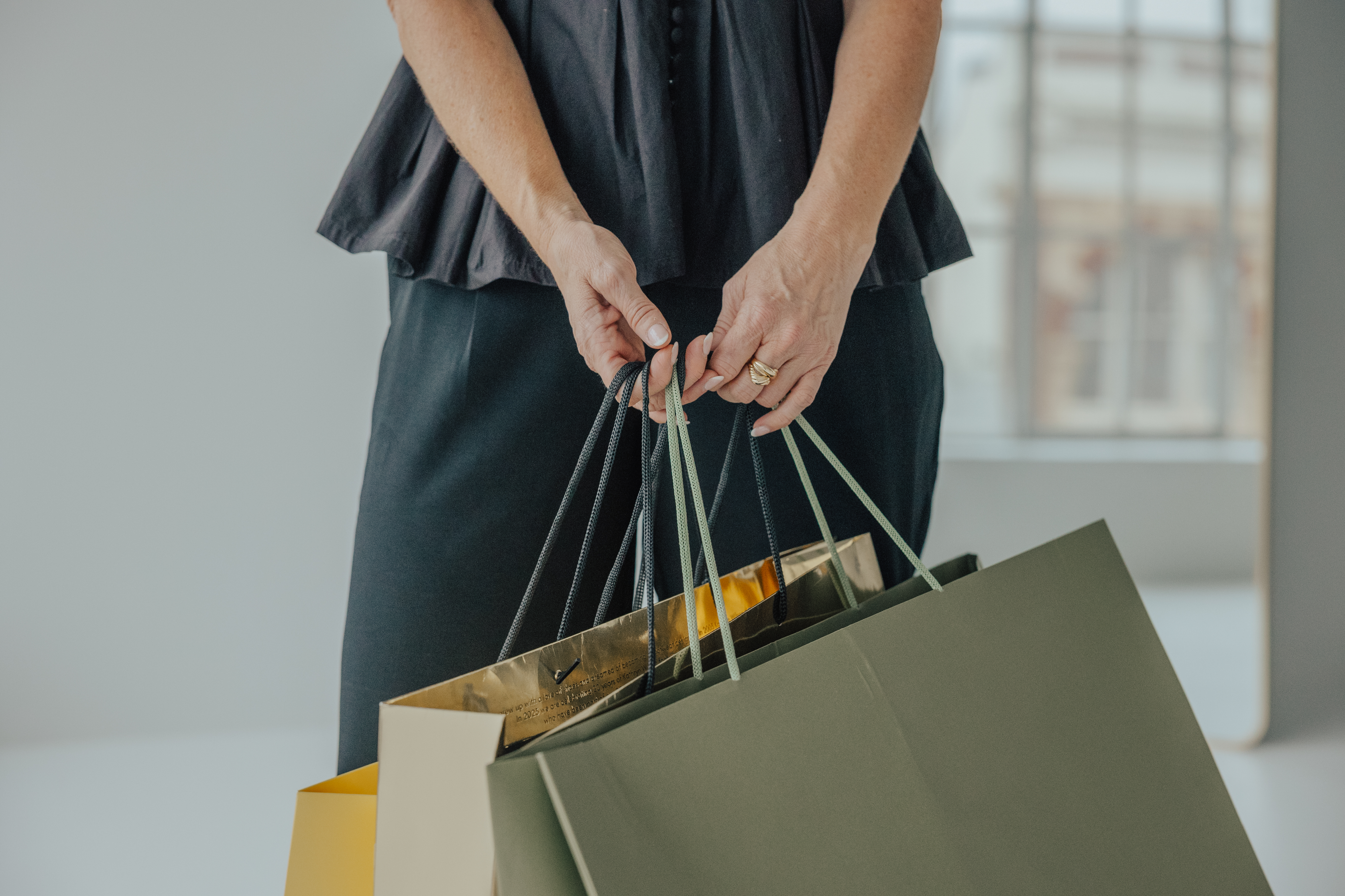 Personal shopping session with Auckland stylist carrying fashion store shopping bags