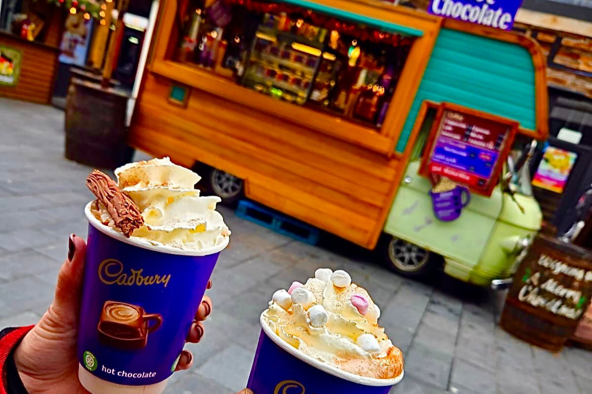 retro vehicle serving ice cream , coffee and cakes