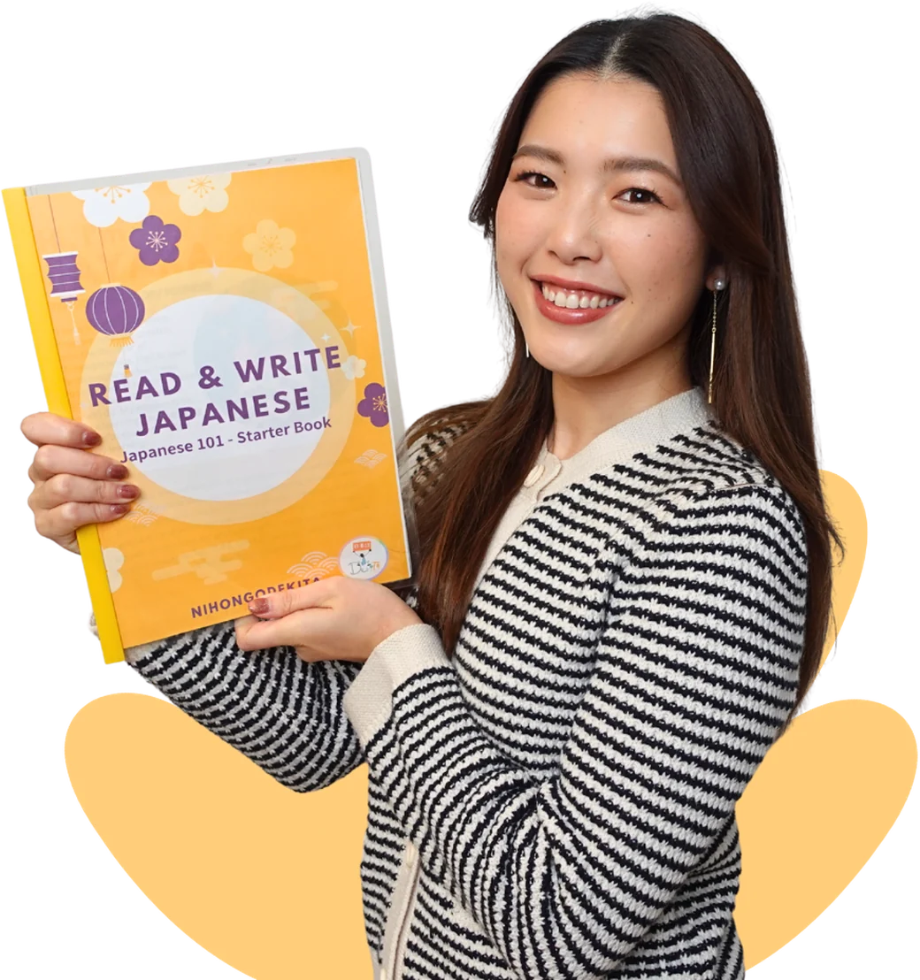 Sayaka Sensei holding the Read and Write Japanese starter book