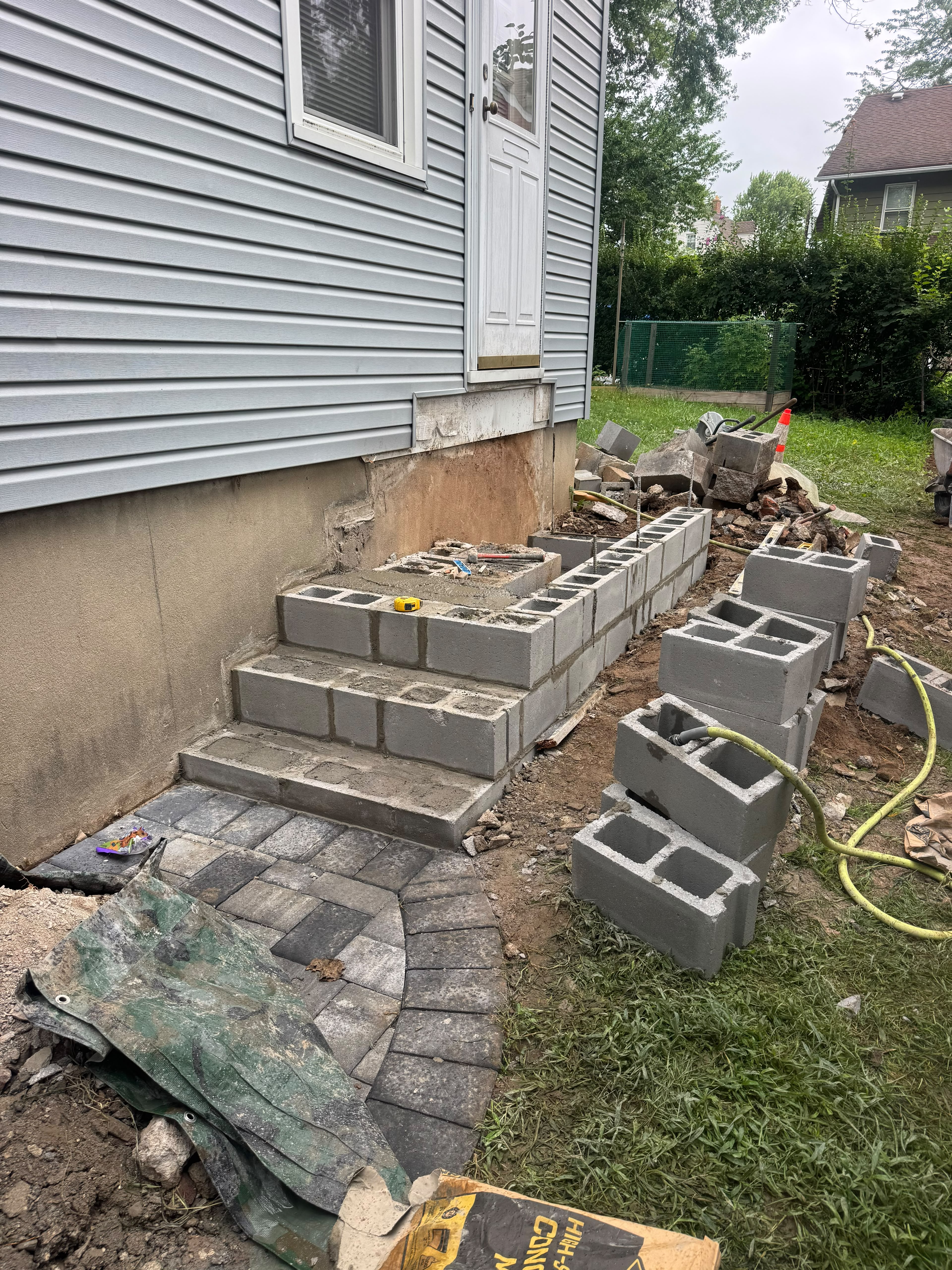 Stone veneer masonry steps with railing in Bloomfield NJ