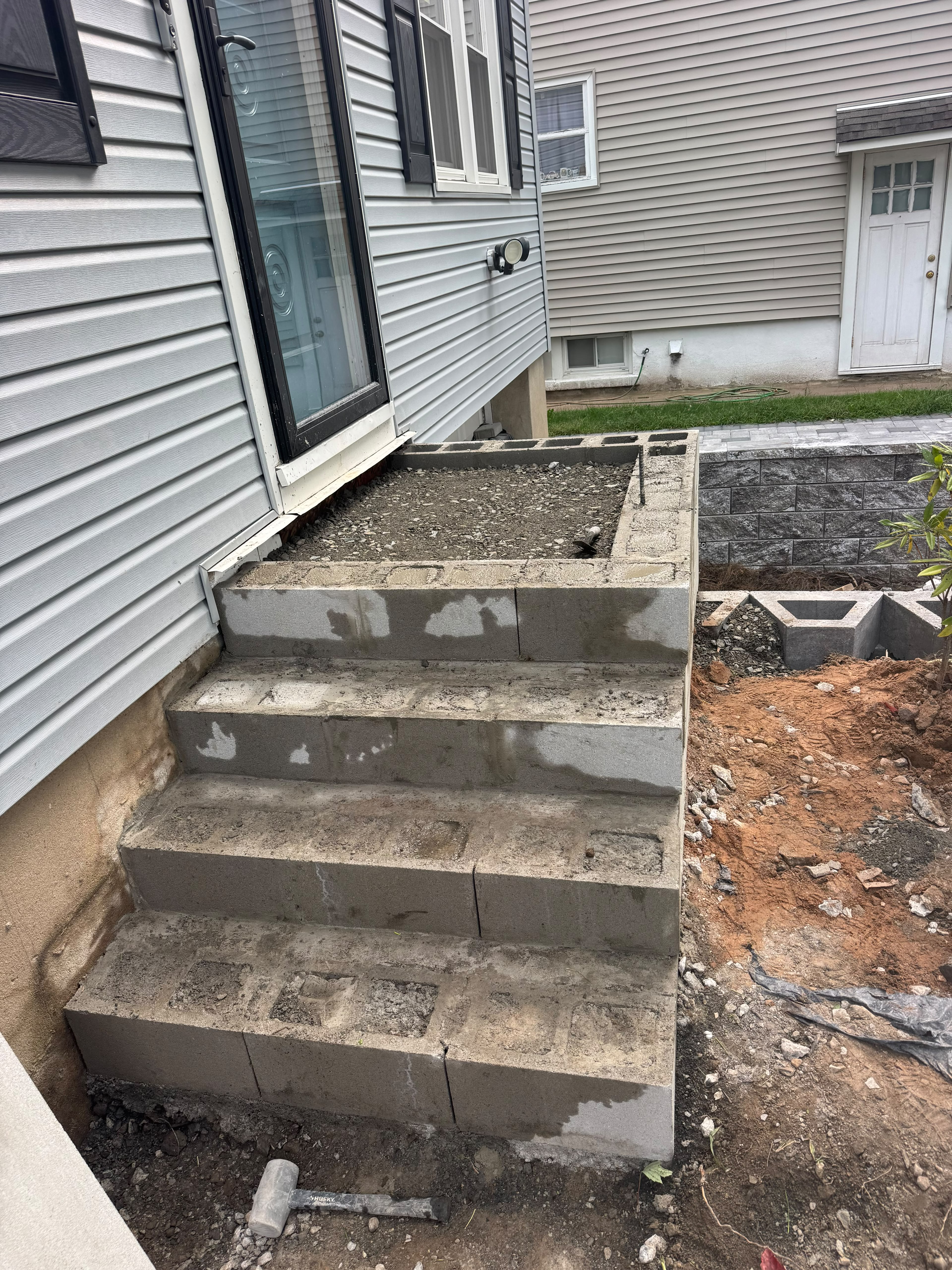 Black railing installation on masonry steps in Essex County NJ