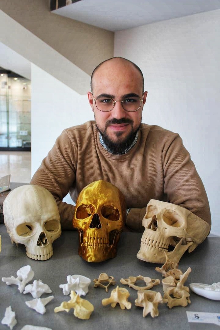 Dr. Vezirov with golden skull models